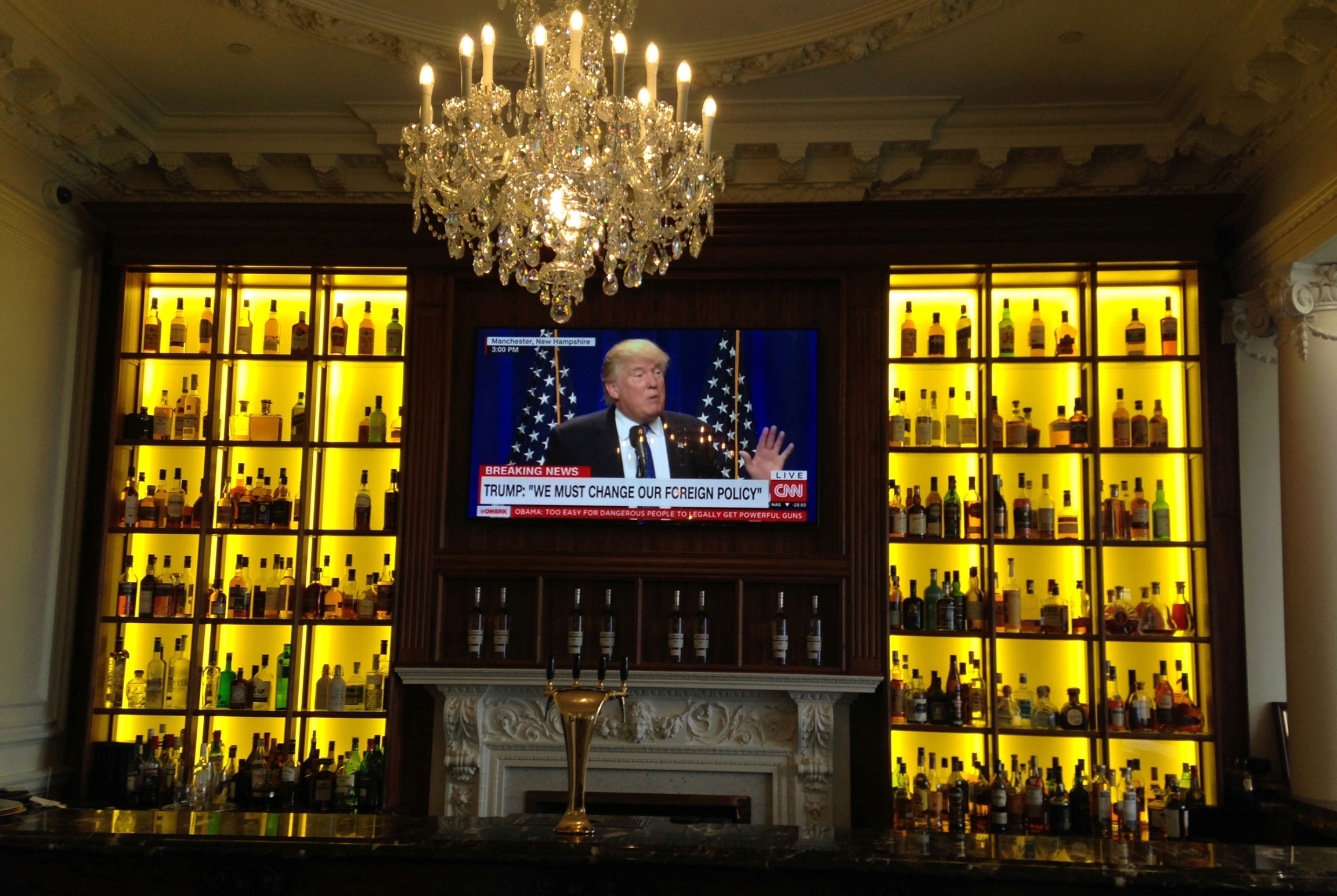 US President Donald Trump is seen on a television screen in the whisky bar at the hotel of the Trump Turnberry golf resort in Turnberry, Scotland, Britain, in 2016. A TV screen on a bar shows US President Donald Trump