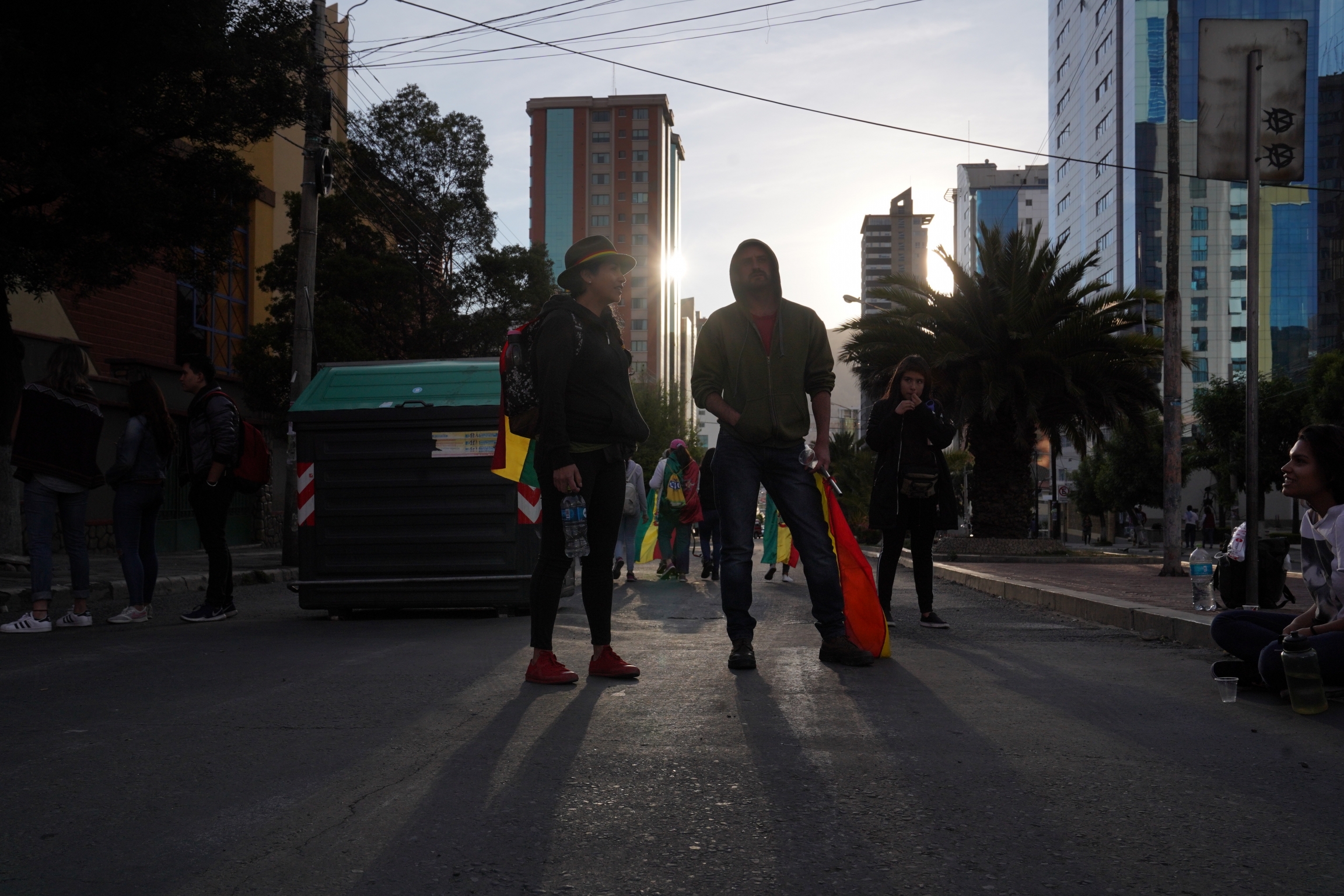 A group of young men blocks a road in Bolivia's capital city to protest the reelection of Bolivian President Evo Morales to his fourth term. Protesters claim he is leading Bolivia toward dictatorship.