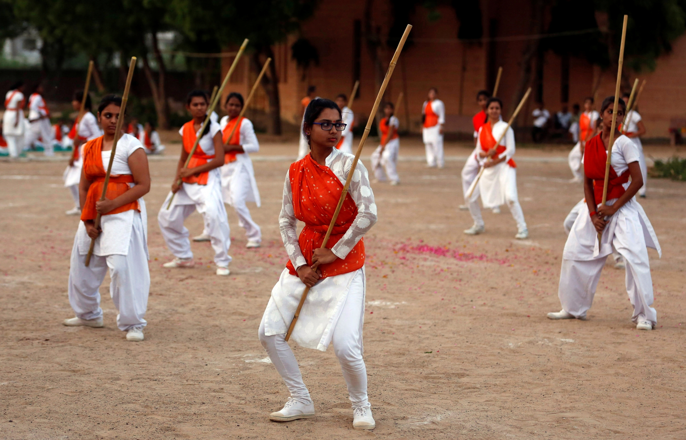 Members of Durga Vahini show their self-defense skills with sticks at the concluding ceremony of a weeklong women's training camp on the outskirts of Ahmedabad, India, May 21, 2016. Members of Durga Vahini show their self-defense skills with sticks at the concluding ceremony of a weeklong women's training camp on the outskirts of Ahmedabad, India, May 21, 2016.