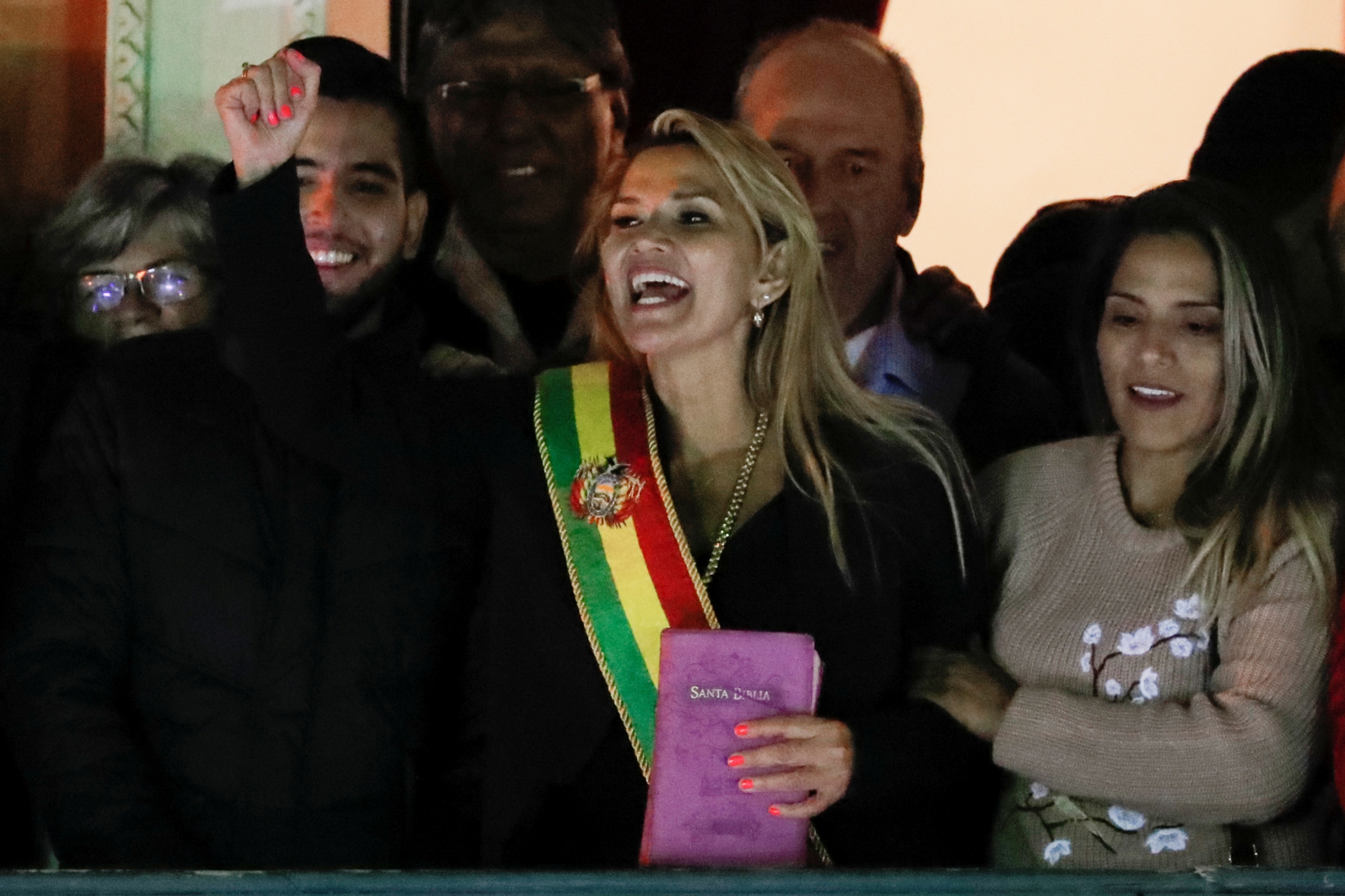 Bolivian Senator Jeanine Añez gestures after she declared herself as Interim President of Bolivia, at the balcony of the Presidential Palace, in La Paz, Bolivia, on Nov. 12, 2019. Bolivian Senator Jeanine Añez gestures after she declared herself as Interim President of Bolivia, at the balcony of the Presidential Palace, in La Paz, Bolivia, on Nov. 12, 2019.