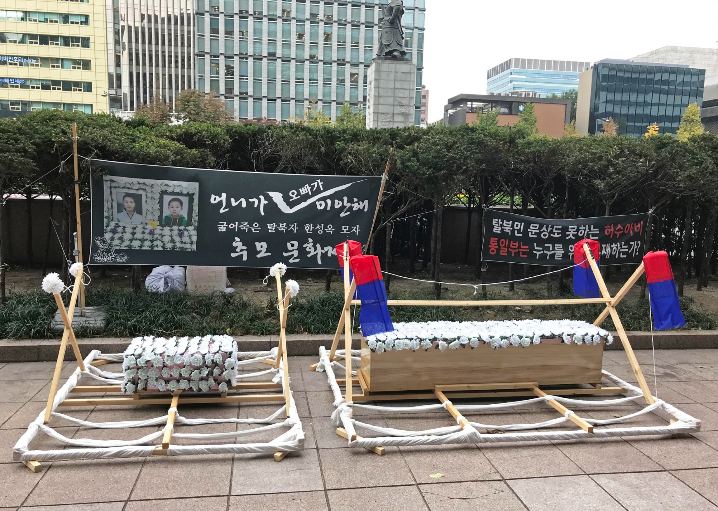 A makeshift memorial created by fellow North Korean defectors honors Han Sung-ok, 42, and her son Kim Dong-jin, 6, who are suspected to have died of starvation in their Seoul-area apartment in July 2019. A makeshift memorial