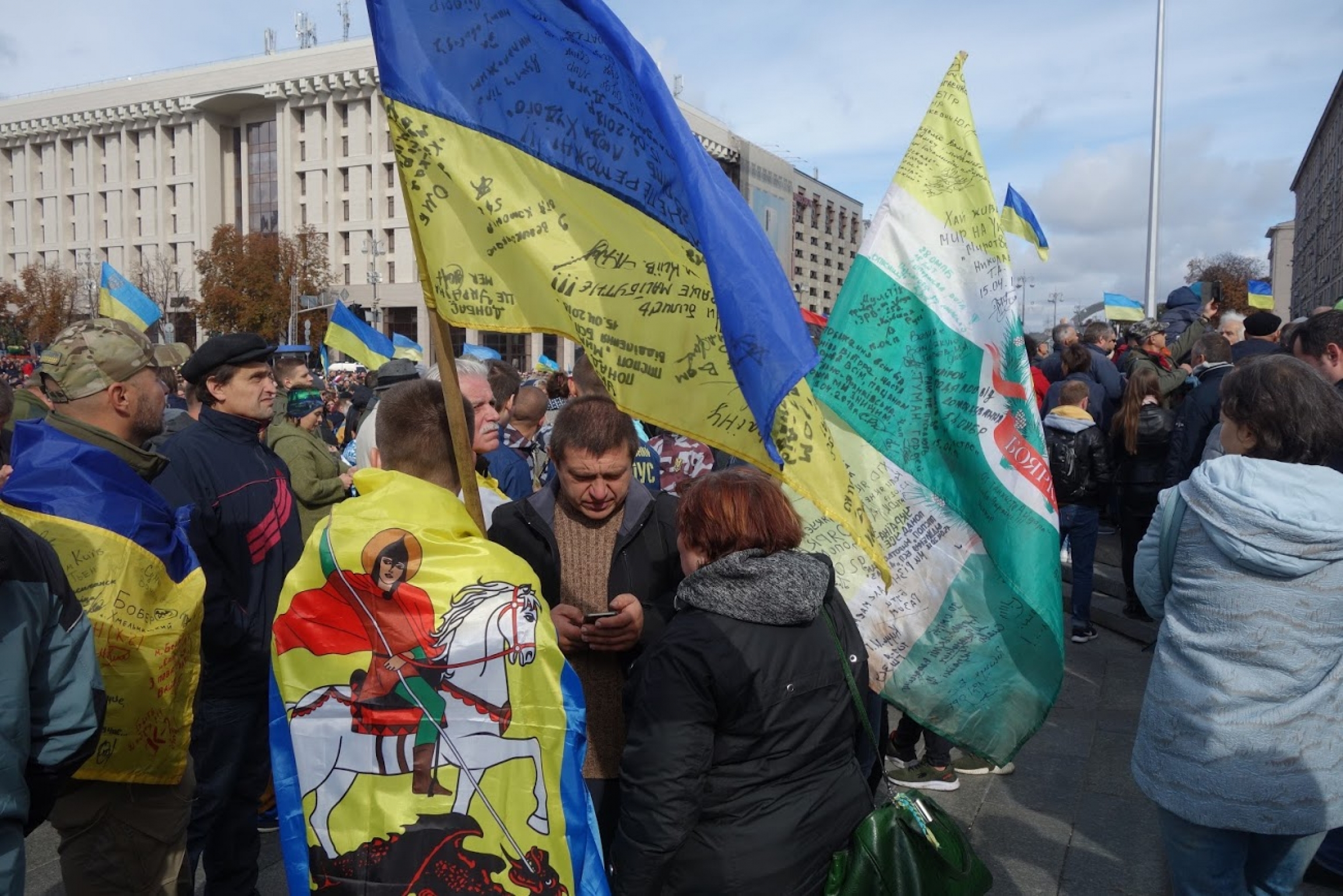 Protesters holding Ukrainian flags gather on Kyiv's Independence Square on Oct. 2, 2019, during an action against a peace agreement backed by Ukrainian President Volodymyr Zelenskiy. Protesters holding Ukrainian flags gather on Kyiv's Independence Square.
