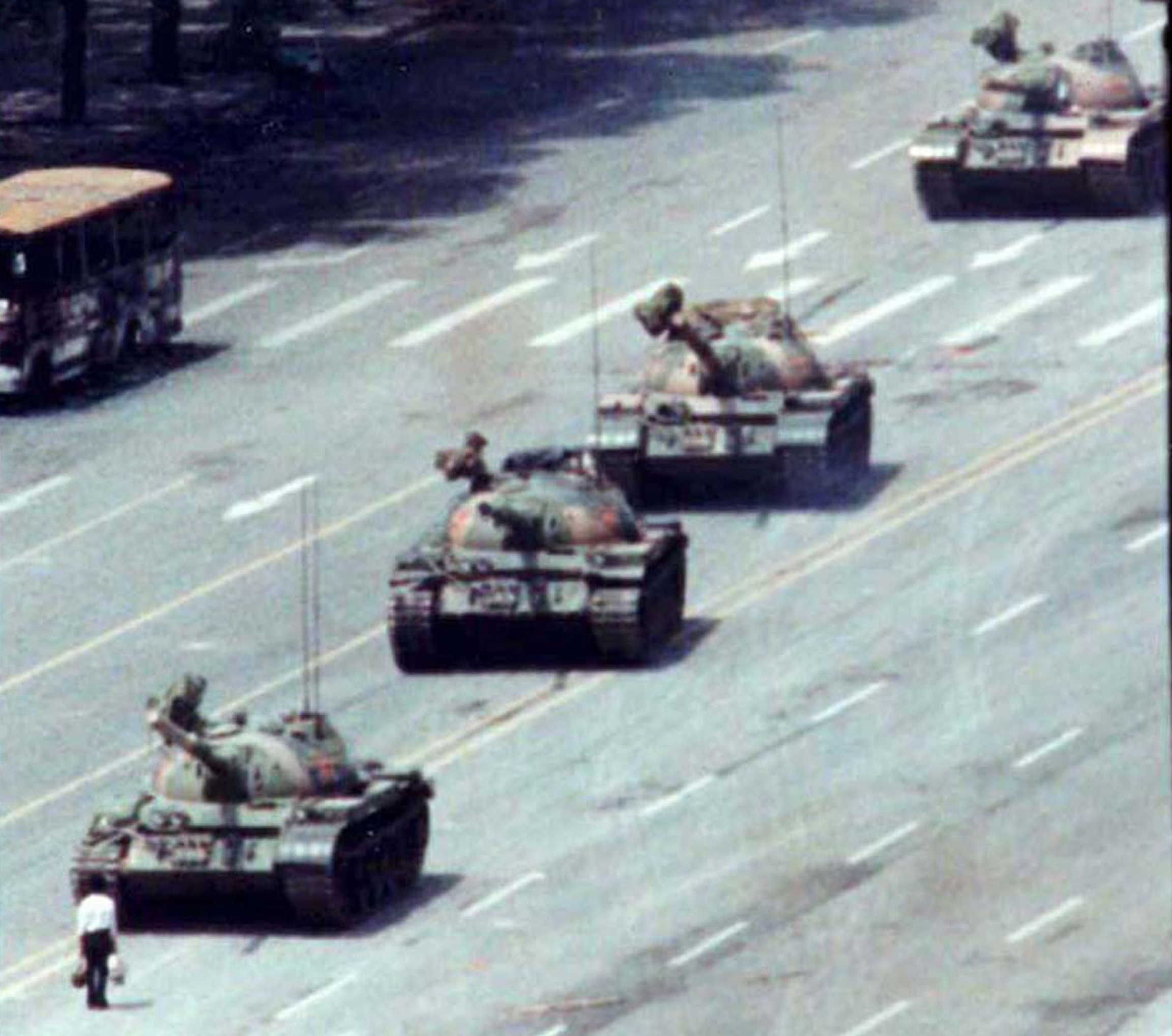 On June 5, 1989, a Chinese man stood alone to block a line of tanks in Tiananmen Square. A man stands in front of a row of tanks.