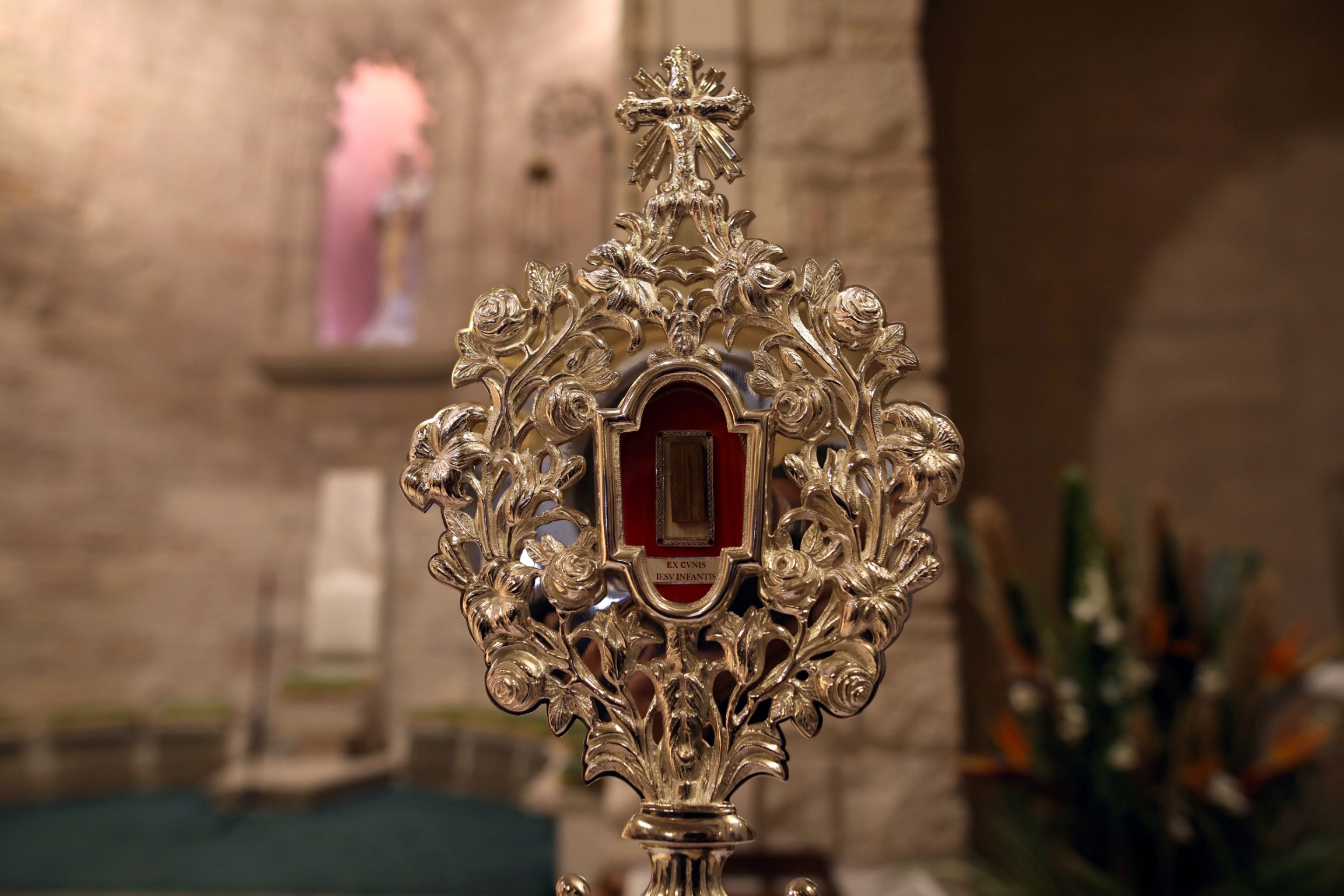A fragment of a wooden relic, reputed to be from Jesus' manger, is show here displayed ahead of its transfer to Jesus' birthplace in Bethlehem for the official launch of Christmas season, in Jerusalem's Notre Dame, on Nov. 29, 2019. A fragment of a wooden relic is shown incased in a large golden medallion