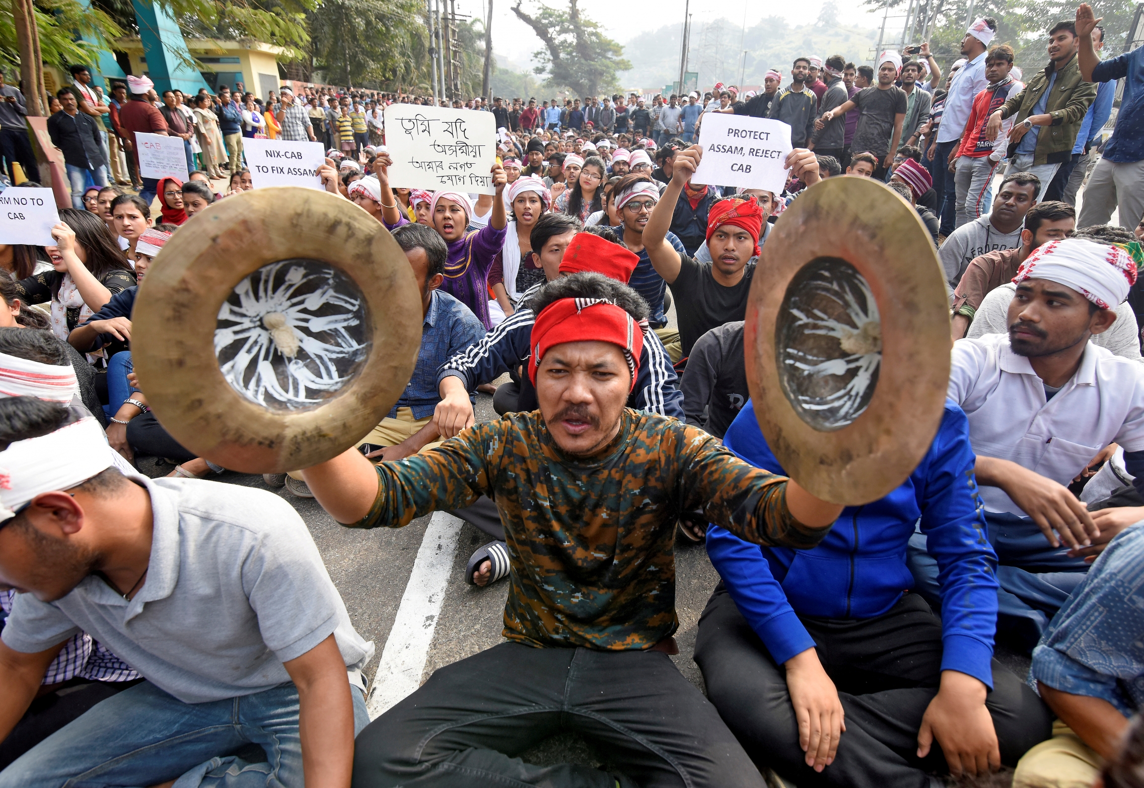 Demonstrators shout slogans during a protest against Citizenship Amendment Act that seeks to give citizenship to religious minorities persecuted in neighboring Muslim countries, in Guwahati, India, Dec. 11, 2019. Artists and singers protest against citizenship act in India