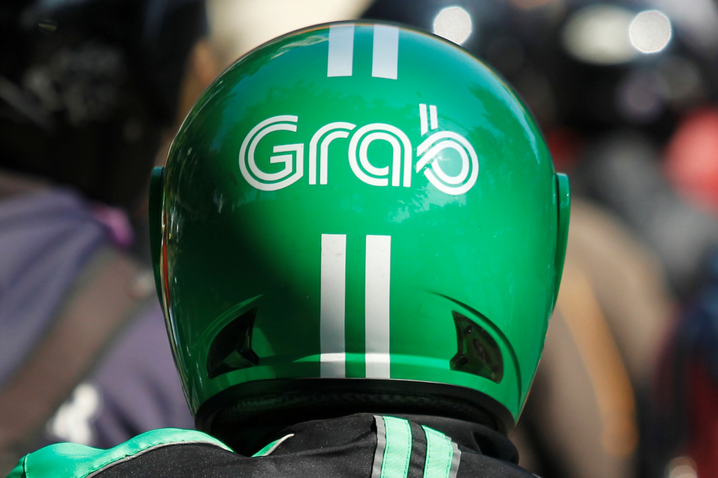 The helmet of a Grab bike rider is seen during rush hour traffic in Jakarta, Indonesia, July 18, 2016. A Grab green helmet up close