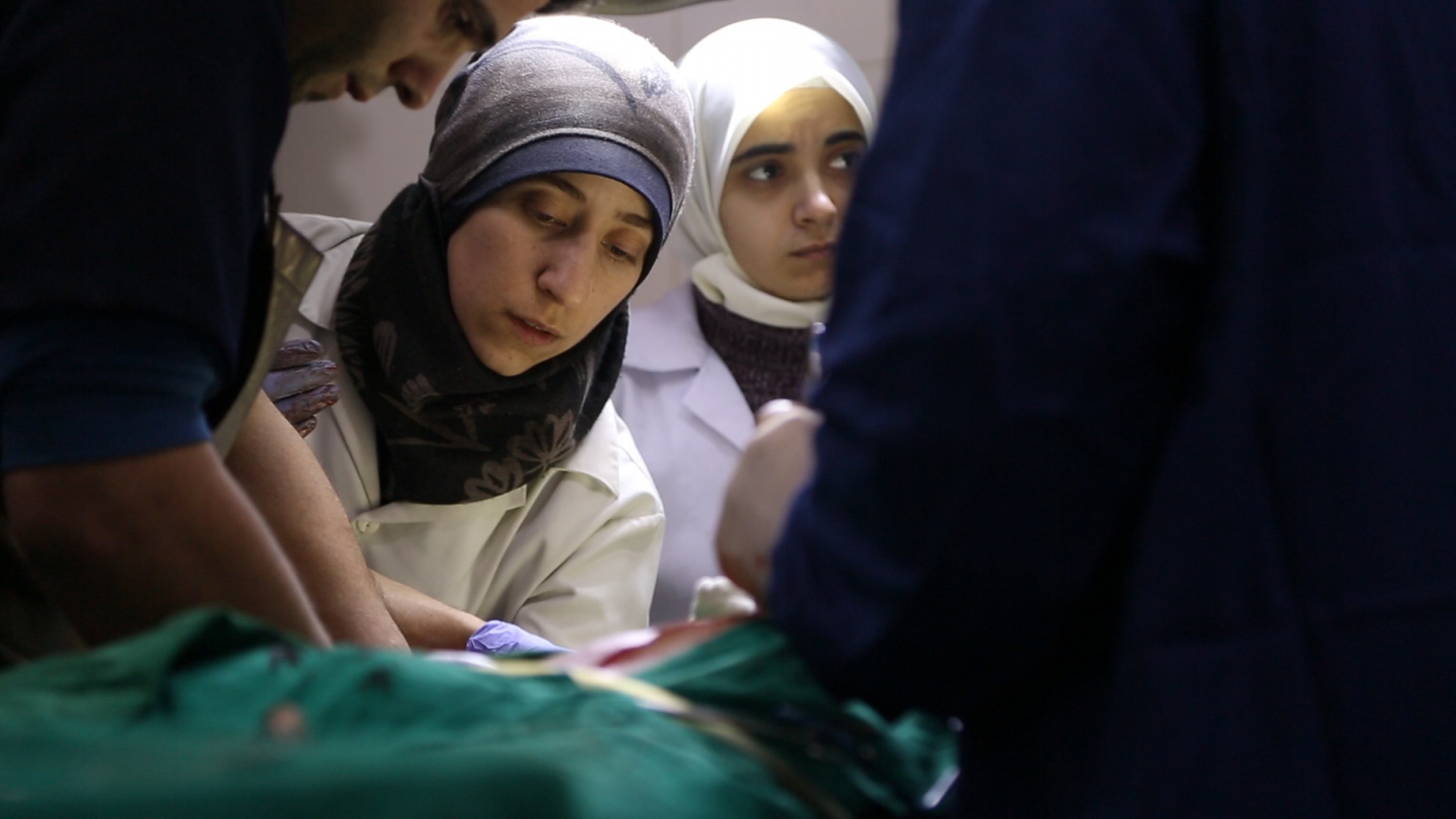 Dr Amani Ballour, who managed an underground hospital during the siege of Eastern Ghouta in Syria, treats a patient in a scene from the film "The Cave" by Syrian director Feras Fayyad. Dr Amani Ballour, who managed an underground hospital during the siege of Eastern Ghouta in Syria, treats a patient in a scene from the film "The Cave" by Syrian director Feras Fayyad.