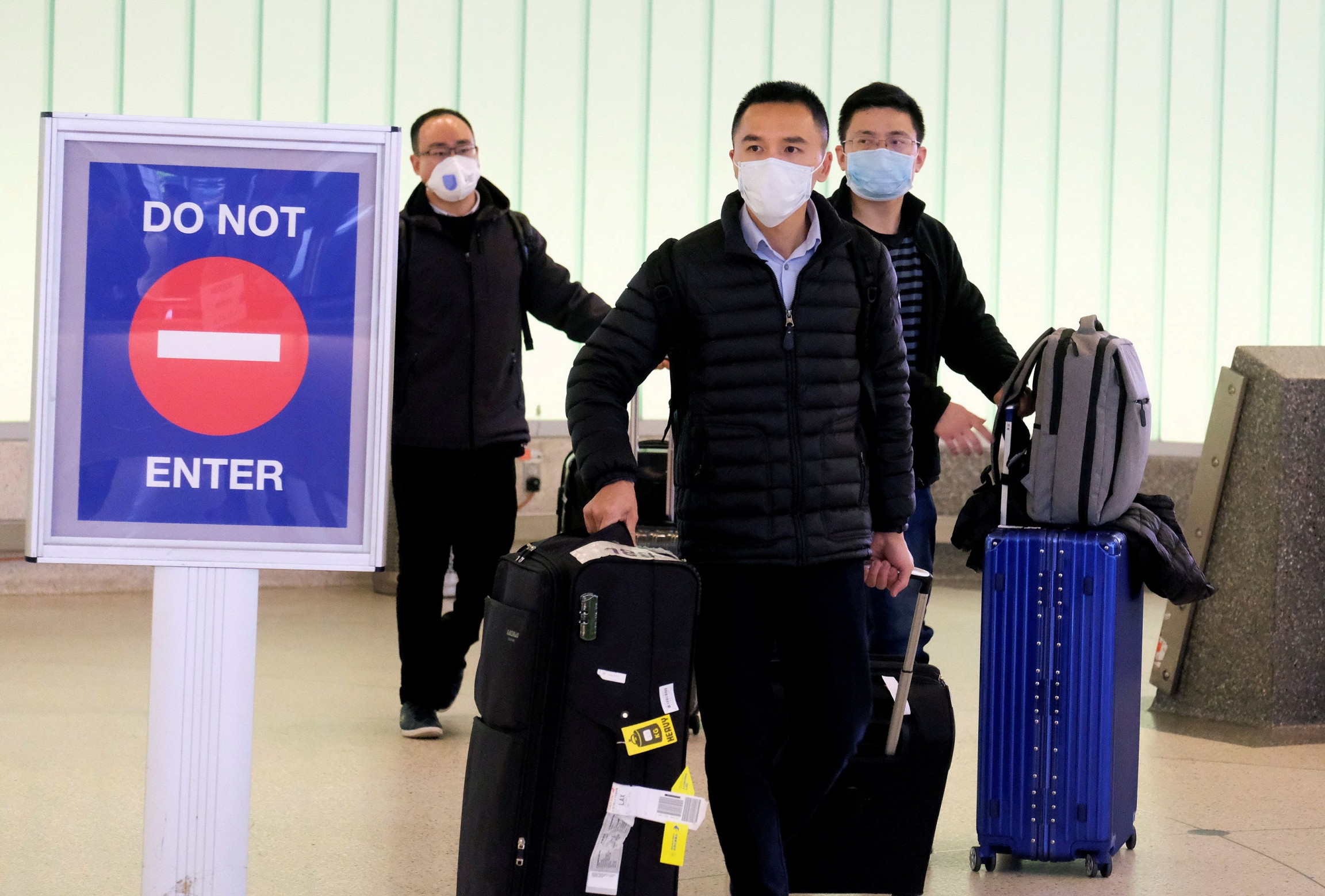 Passengers arrive at LAX from Shanghai, China, after a positive case of the coronavirus was announced in the Orange County suburb of Los Angeles, Jan. 26, 2020. Passengers arrive at LAX from Shanghai, China, after a positive case of the coronavirus was announced in the Orange County suburb of Los Angeles, Jan. 26, 2020.