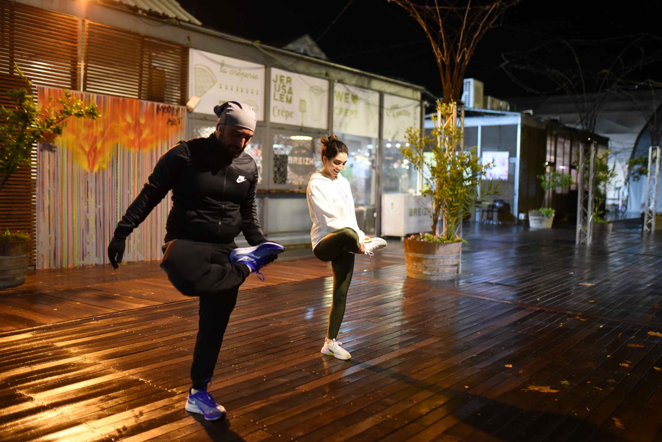 Right to Movement members stretch after their run. Runners stretch after running together.