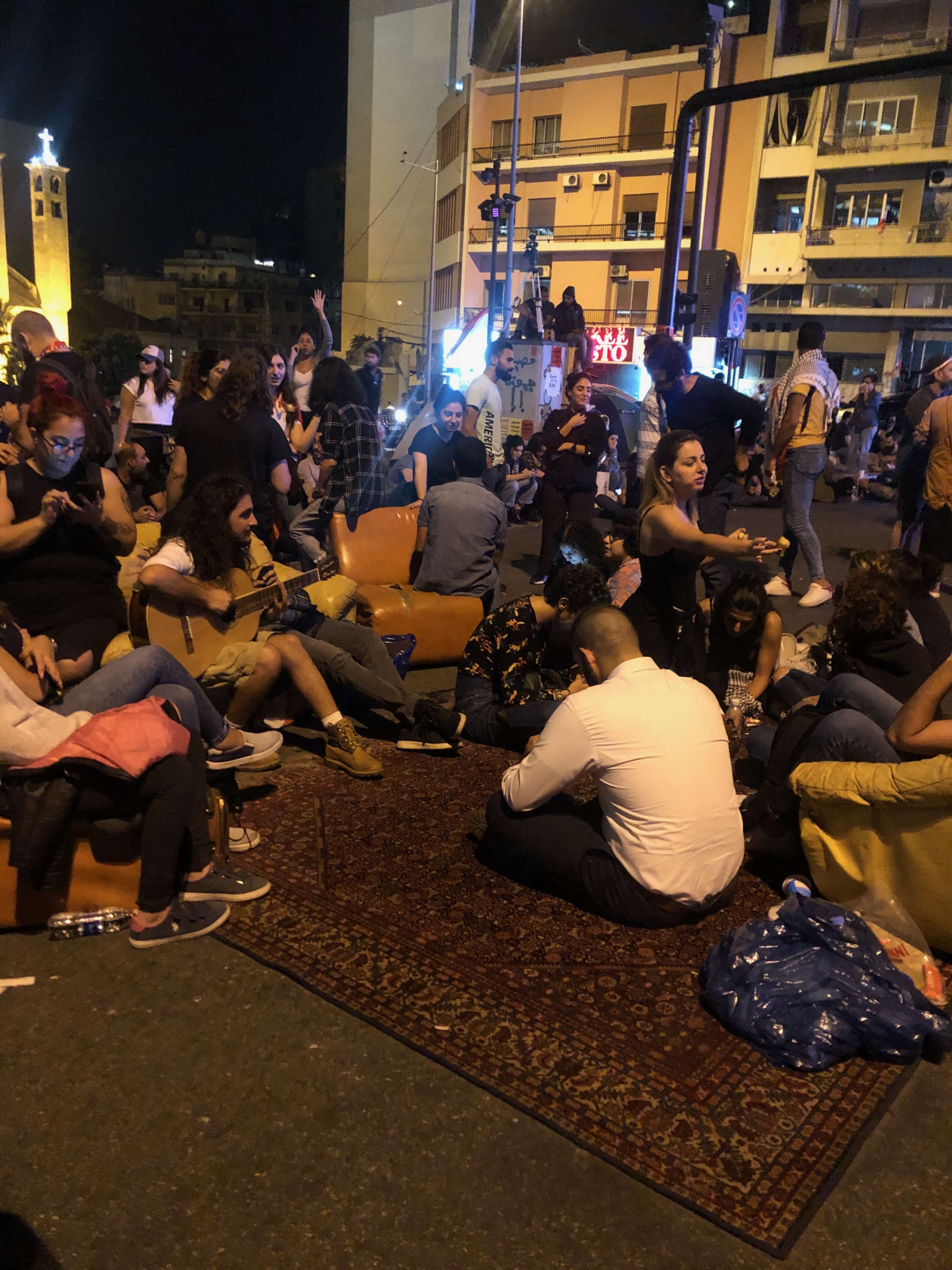 Protesters lay on a carpet as they block Beirut's Ring Bridge. Protesters lay on a carpet as they block Beirut's Ring Bridge.