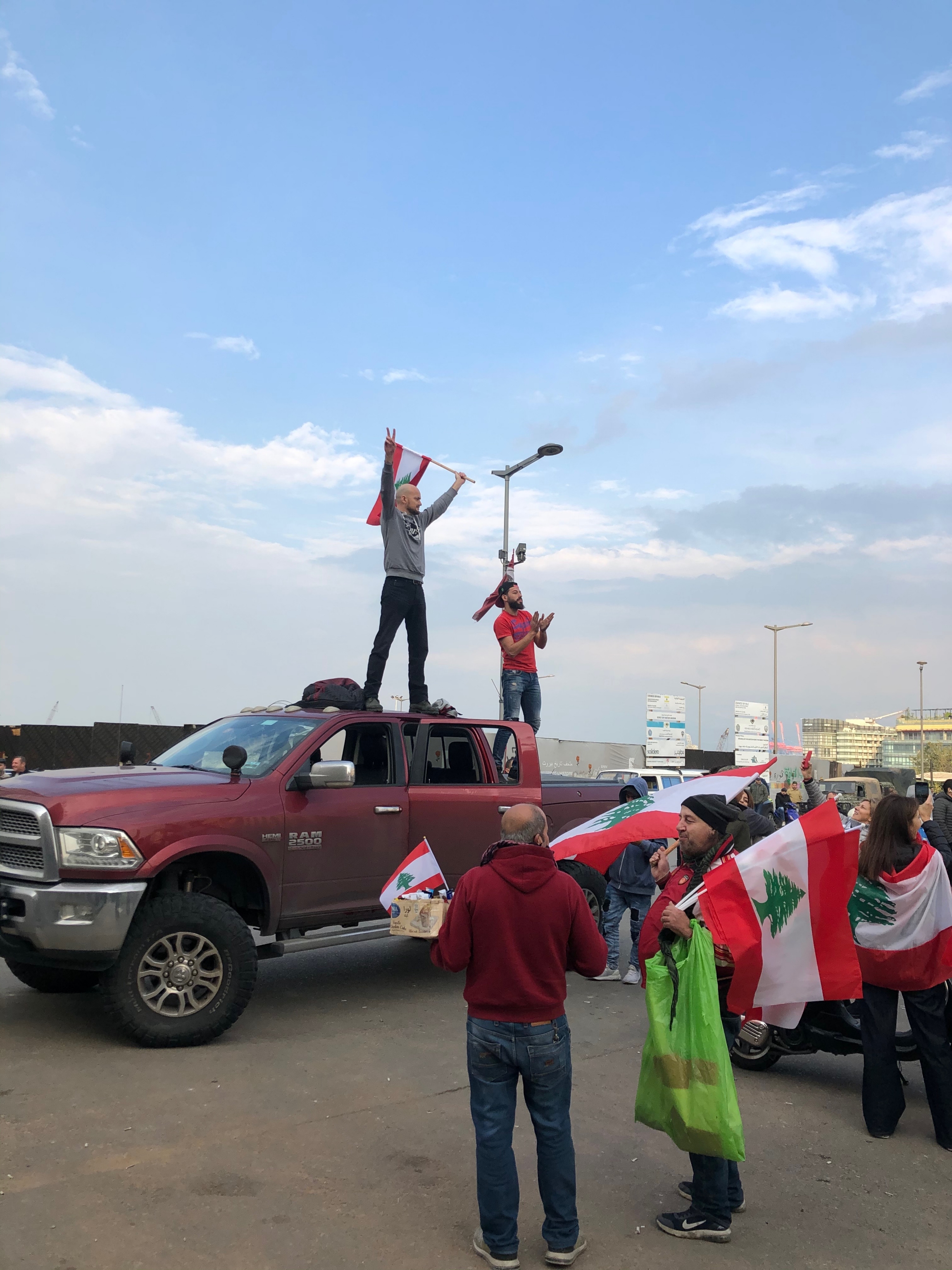 Protester uses his truck to block a road leading to Martyrs' Square in Beirut. Protester uses his truck to block a road leading to Martyrs' Square in Beirut.
