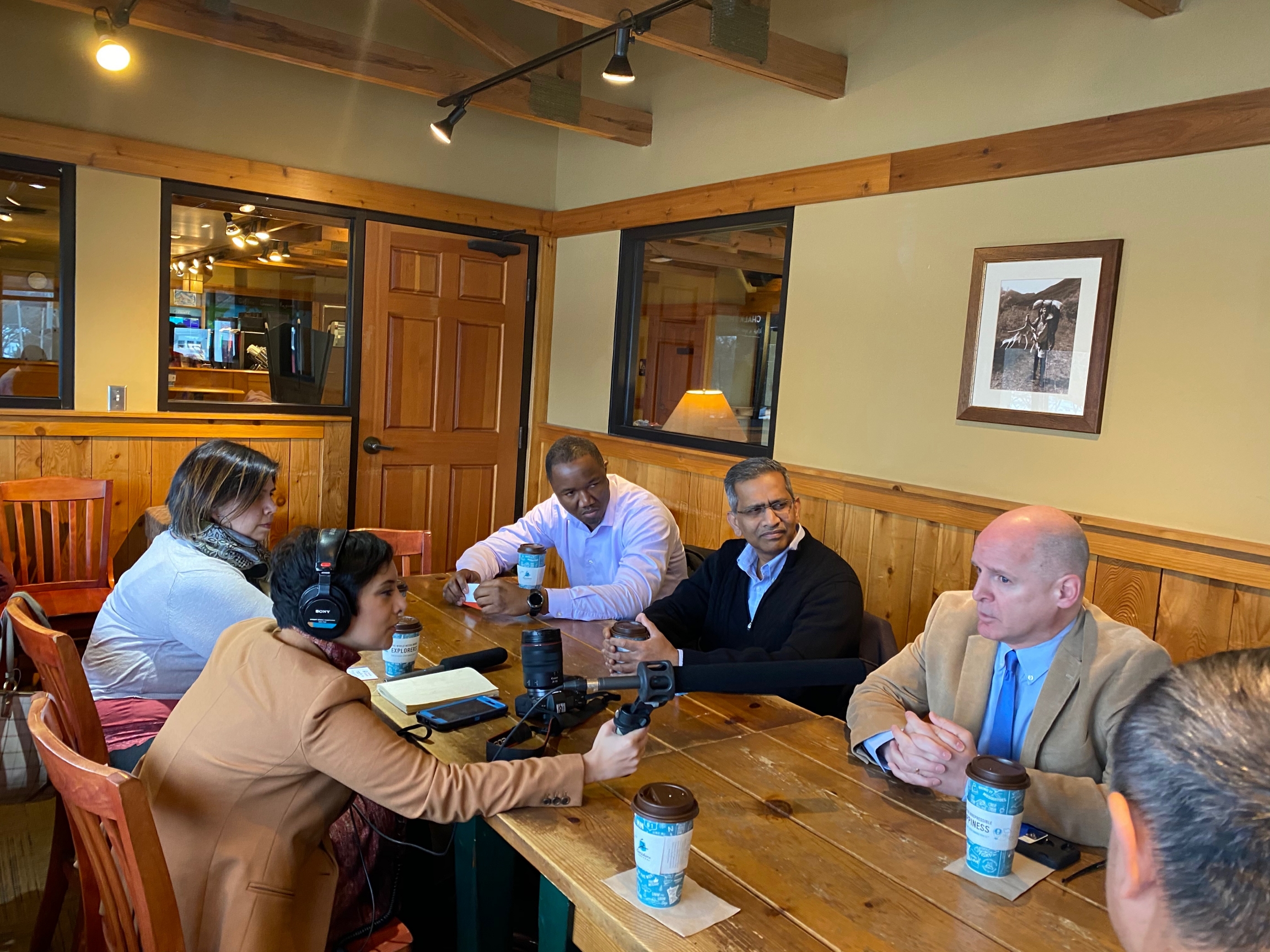 Reporter Rupa Shenoy meets with politically active immigrants and refugees in the back conference room of a Caribou Coffee in Des Moines. Reporter Rupa Shenoy meets with politically active immigrants and refugees in the back conference room of a Caribou Coffee in Des Moines.