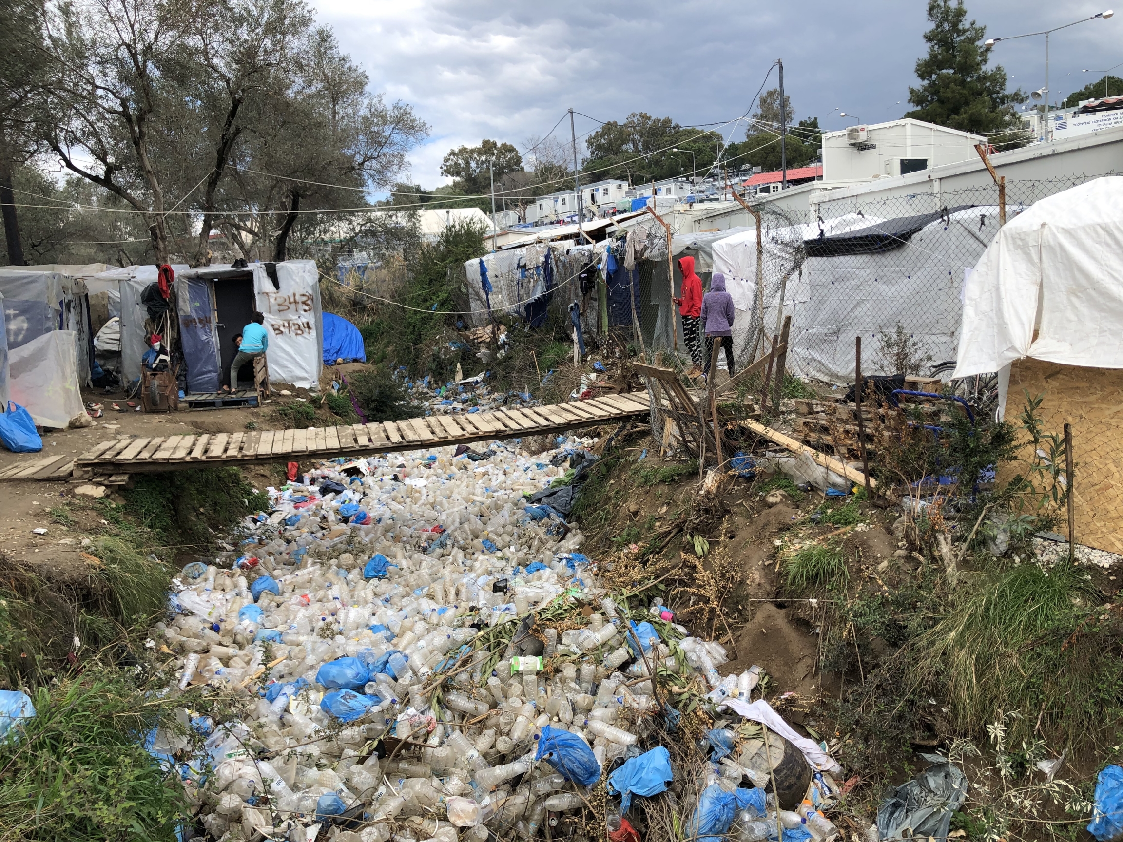 Garbage is strewn between tents in Moria, an overcrowded refugee camp on the Greek island of Lesbos. Garbage is strewn between tents in Moria, an overcrowded refugee camp on the Greek island of Lesbos.