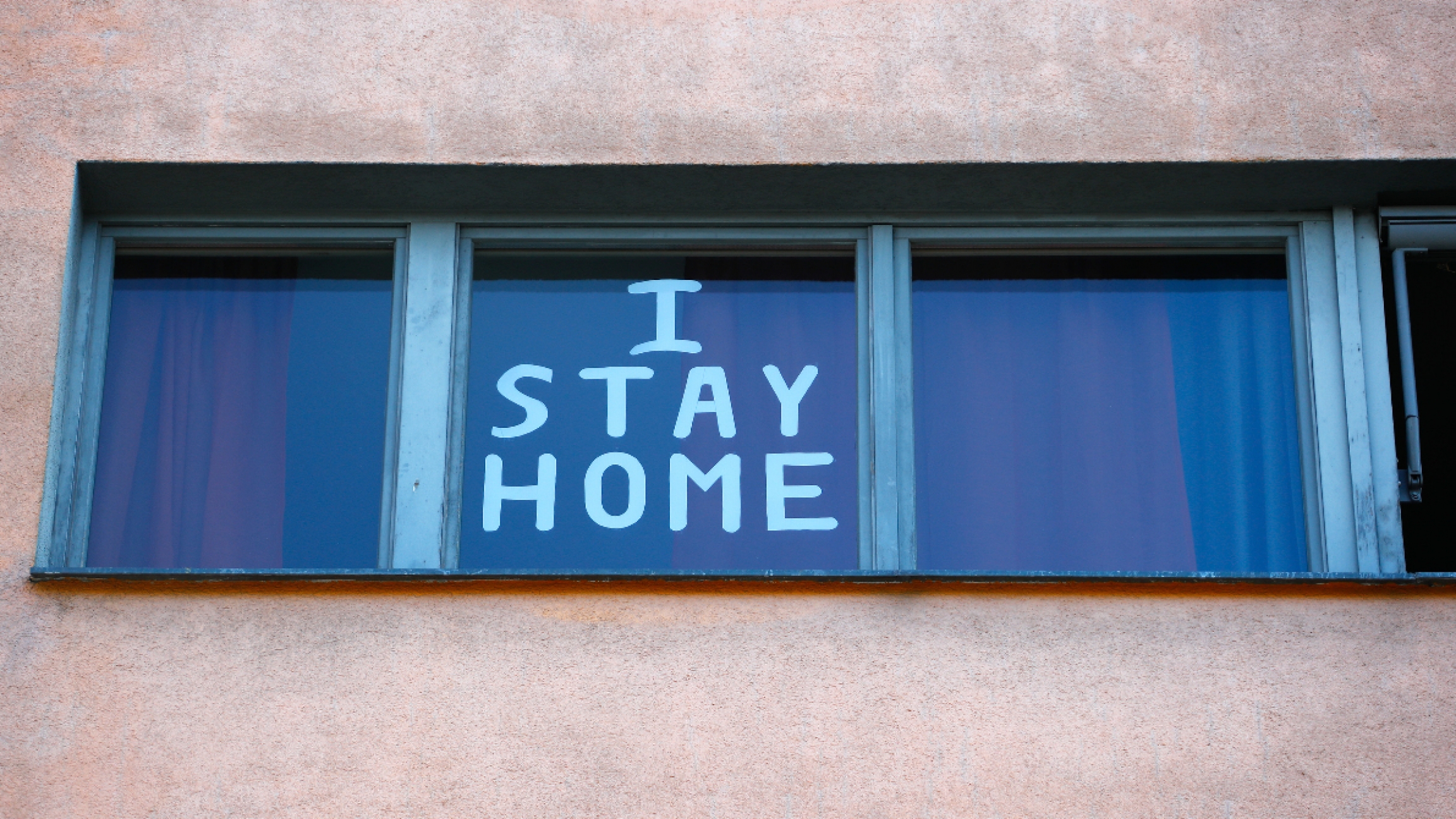 Germany. a sign on the window reads, I stay home.