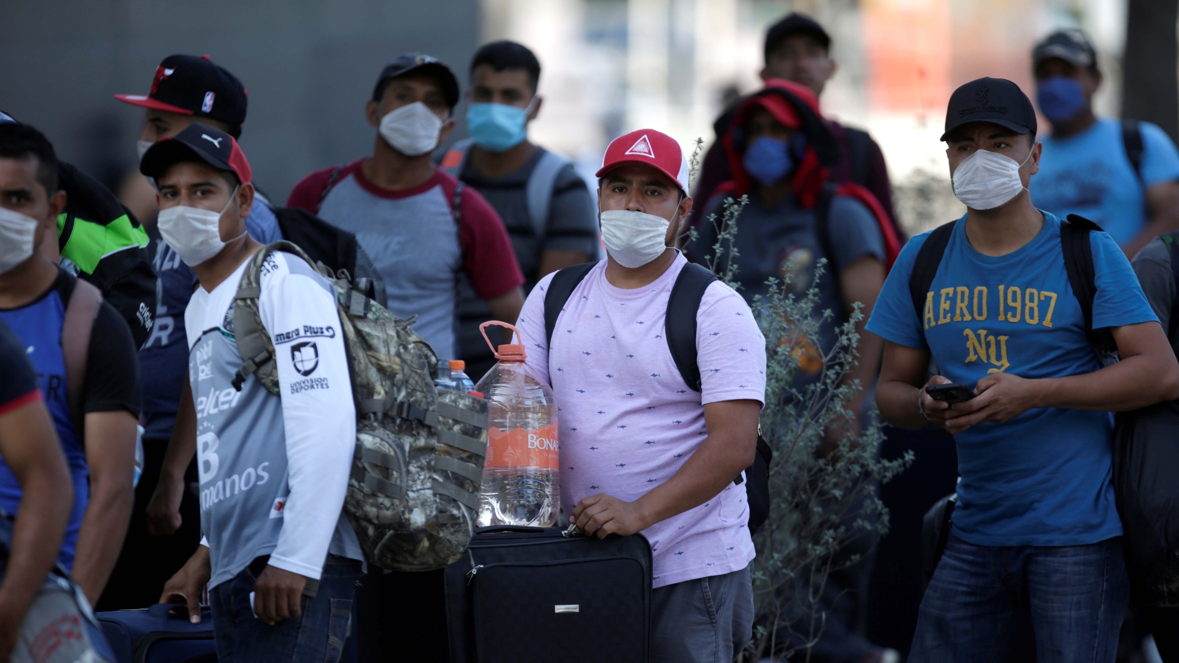 Migrants seeking for a U.S. work visa are pictured after being evicted from their hotel, which local authorities said was crowded, as part of the measures to prevent the spreading of the coronavirus disease (COVID-19), in Monterrey, Mexico March 24, 2020. Migrants seeking for a U.S. work visa are pictured after being evicted from their hotel, which local authorities said was crowded, as part of the measures to prevent the spreading of the coronavirus disease (COVID-19), in Monterrey, Mexico March 24, 2020.