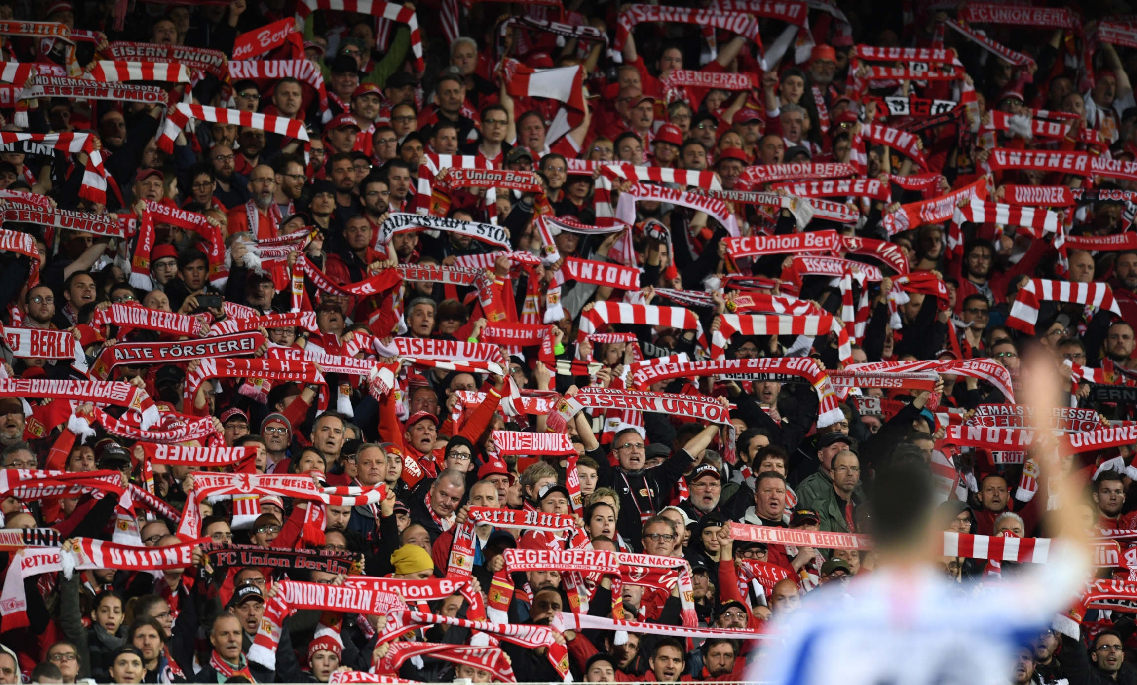 1. FC Union Berlin fans hold up their scarves during the match on Nov. 2, 2019, Berlin, Germany. 1. FC Union Berlin fans hold up their scarves during the match on Nov. 2, 2019, Berlin, Germany.