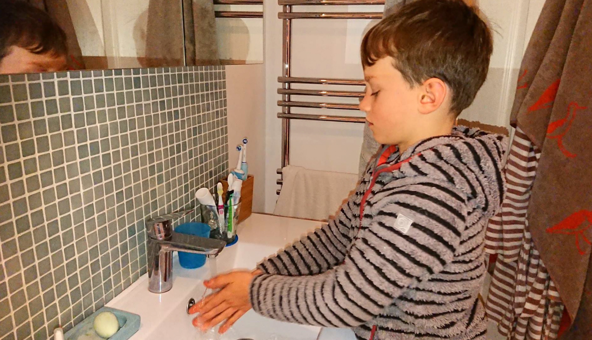 Jacob Gortmans demonstrates the proper 20-second hand-washing duration at his home in London. Jacob Gortmans demonstrates the proper 20-second hand-washing duration at his home in London.
