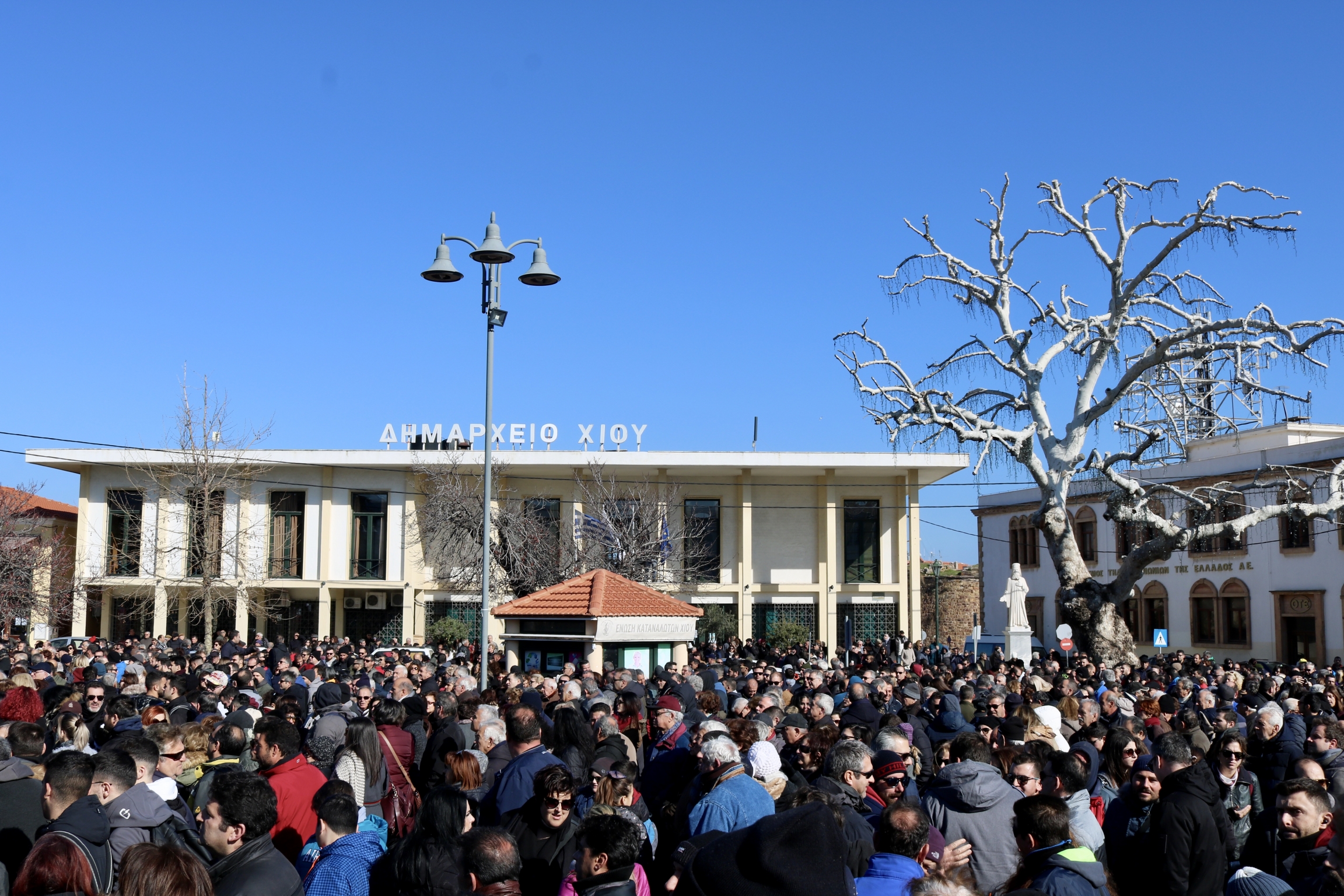 Residents of Chios gather in the town square on on Jan. 22, 2020, in protest to the planned construction of closed migrant detention camps on the island. Residents of Chios gather in the town square on on Jan. 22, 2020 ,in protest to the planned construction of closed migrant detention camps on the island.