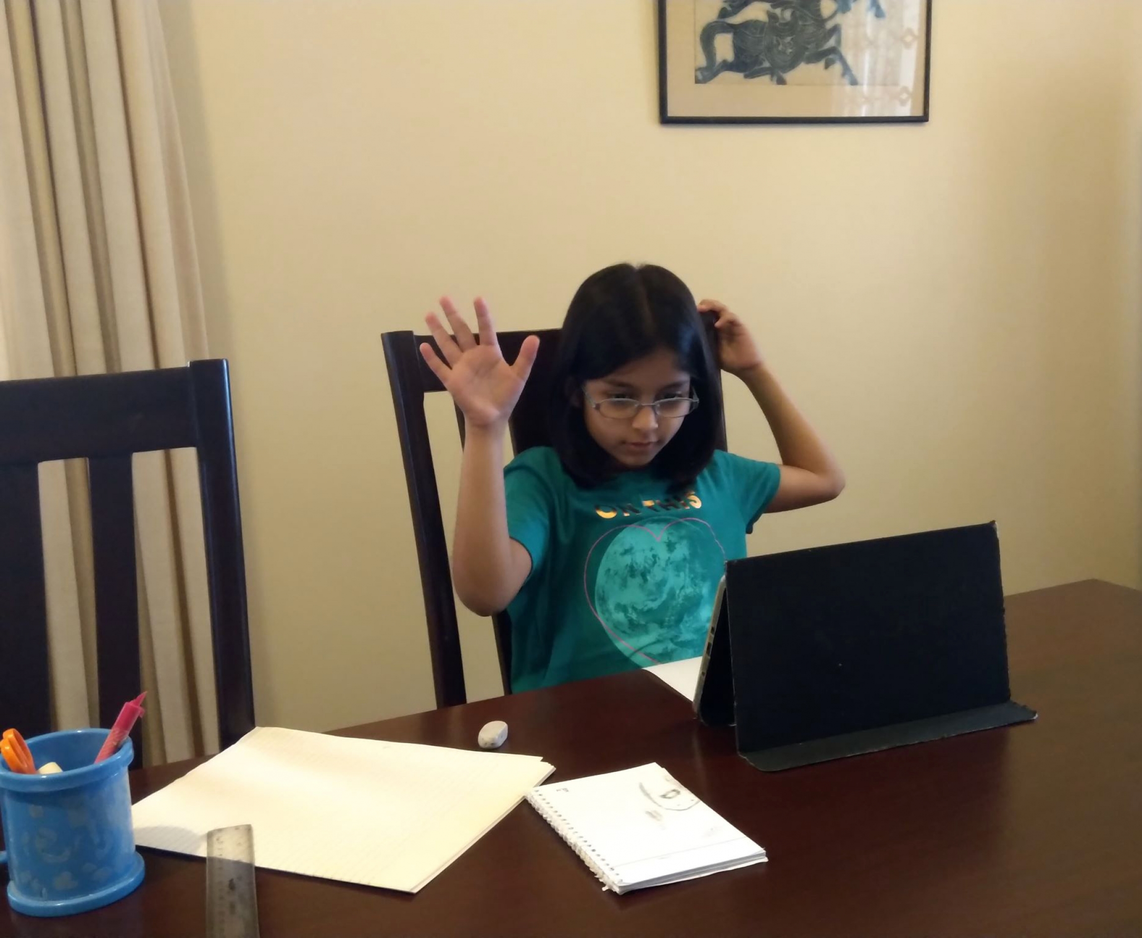 Farah Husain of Karachi, Pakistan, participates in her online school lesson from home. Farah Husain of Karachi, Pakistan, participates in her online school lesson from home.