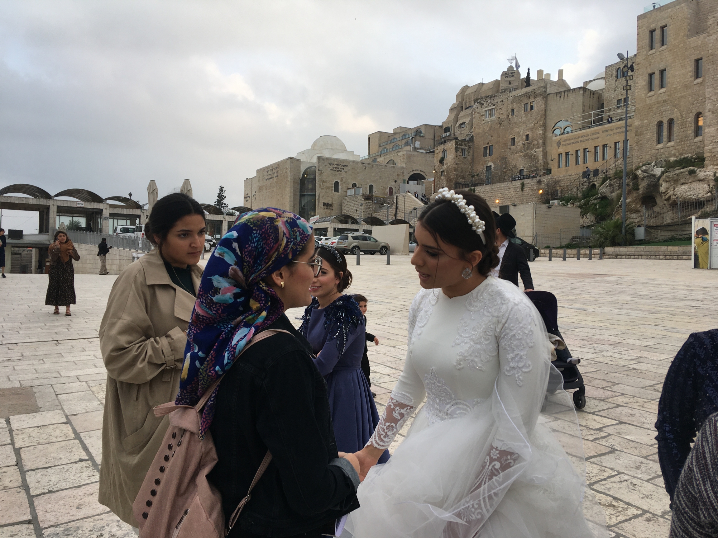 Idit Tedgi gets close to other worshippers to offer blessings on her wedding day. Idit Tedgi gets close to other worshippers to offer blessings on her wedding day.