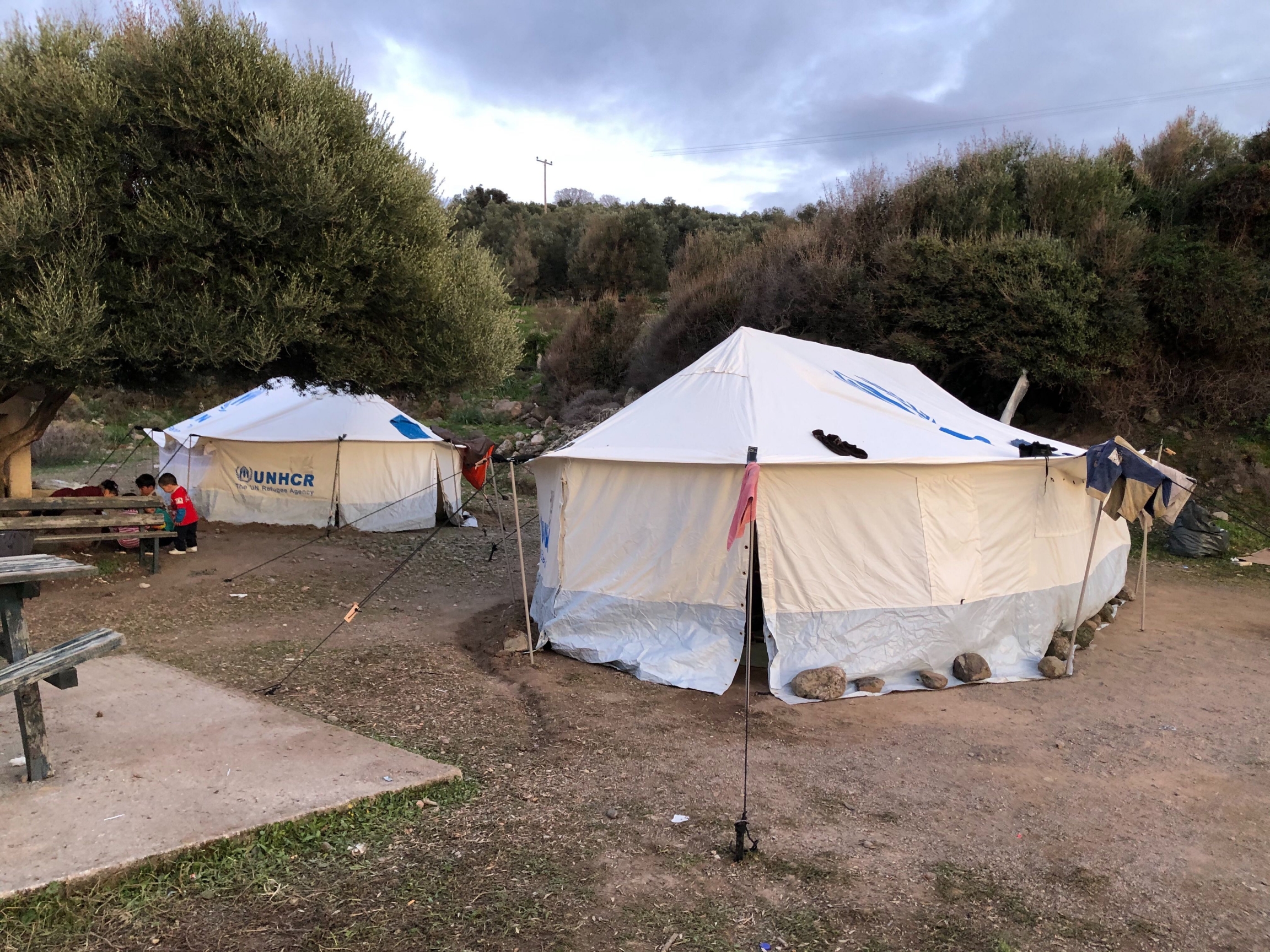 Children play near a makeshift refugee camp on the Greek island of Lesbos.