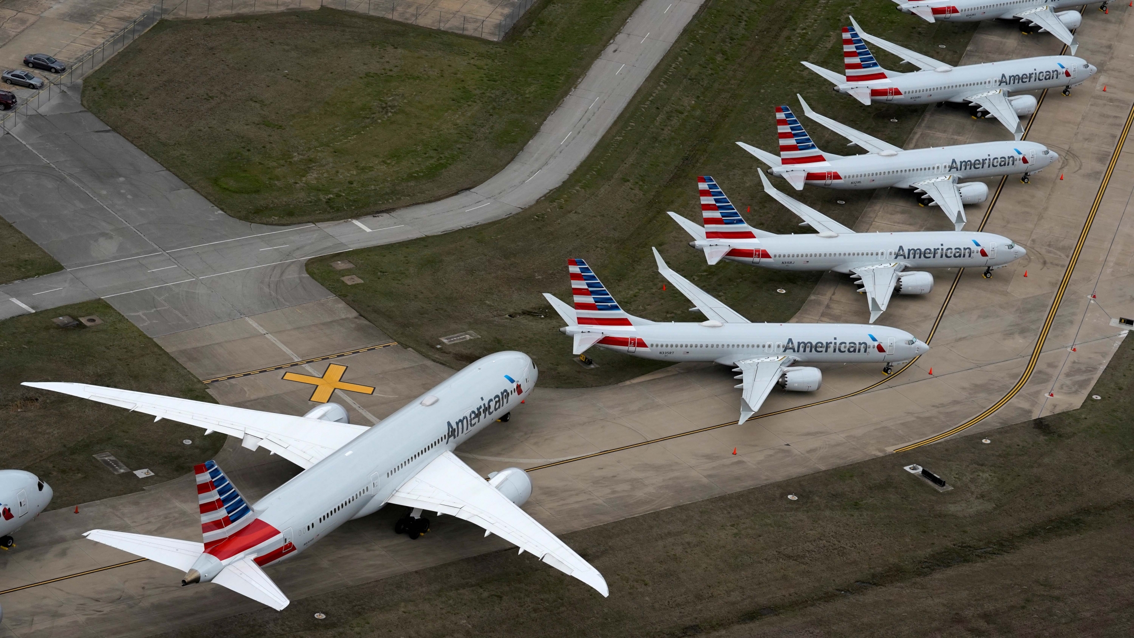 American Airlines passenger planes parked due to flight reductions made to slow the spread of coronavirus disease (COVID-19), at Tulsa International Airport in Tulsa, Oklahoma, on March 23, 2020. American Airlines passenger planes parked due to flight reductions made to slow the spread of coronavirus disease (COVID-19), at Tulsa International Airport in Tulsa, Oklahoma, on March 23, 2020.