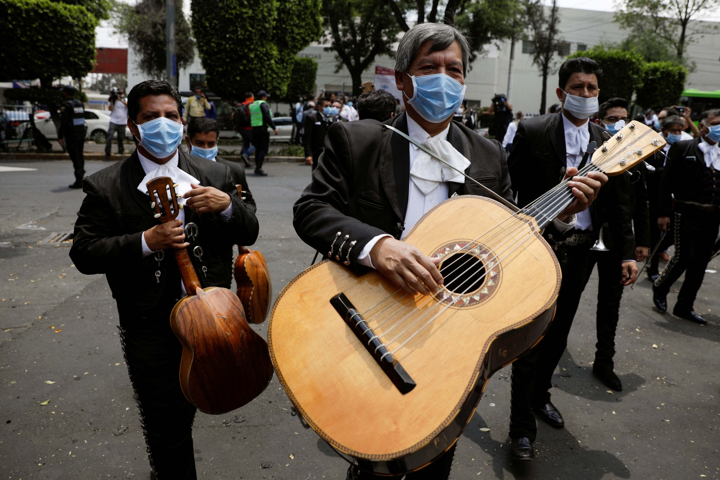 Members of a mariachi band are seen after delivering a serenade for the medical staff of the National Institute of Respiratory Diseases during the coronavirus outbreak, in Mexico City, Mexico, April 7, 2020. Members of a mariachi band wearing masks are seen after delivering a serenade for the medical staff of the National Institute of Respiratory Diseases during the coronavirus outbreak, in Mexico City, Mexico, April 7, 2020.