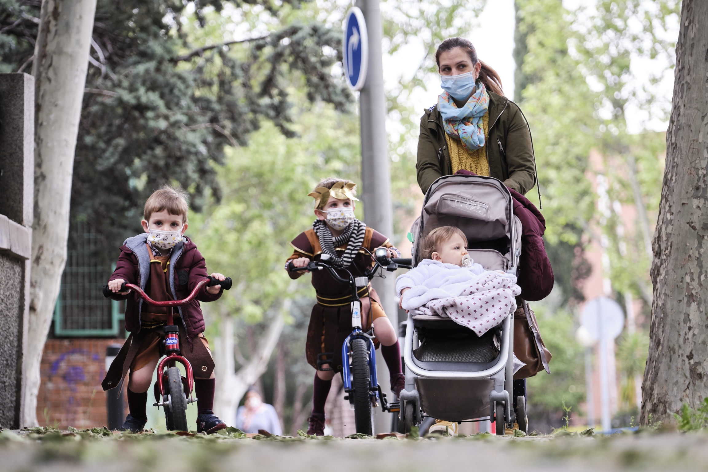 Begoña, a mother of three, takes her children for a walk on the day Spain lifts restrictions on children outdoors due to the coronavirus pandemic Begoña, a mother of three, takes her children for a walk on the day Spain lifts restrictions on children outdoors due to the coronavirus pandemic