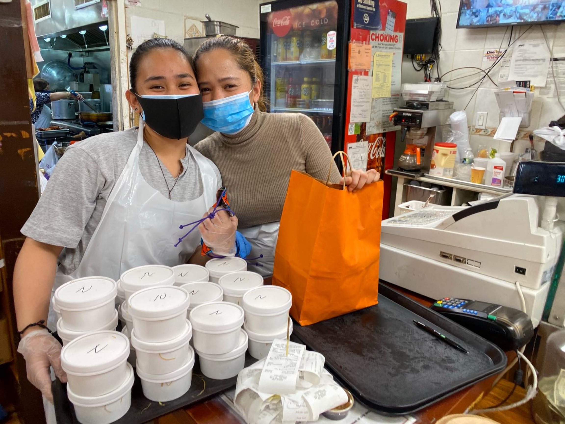 Food workers packing up meals for Filipino health workers at Kabayan restaurant in Woodside, Queens. Food workers packing up meals for Filipino health workers at Kabayan restaurant in Woodside, Queens.