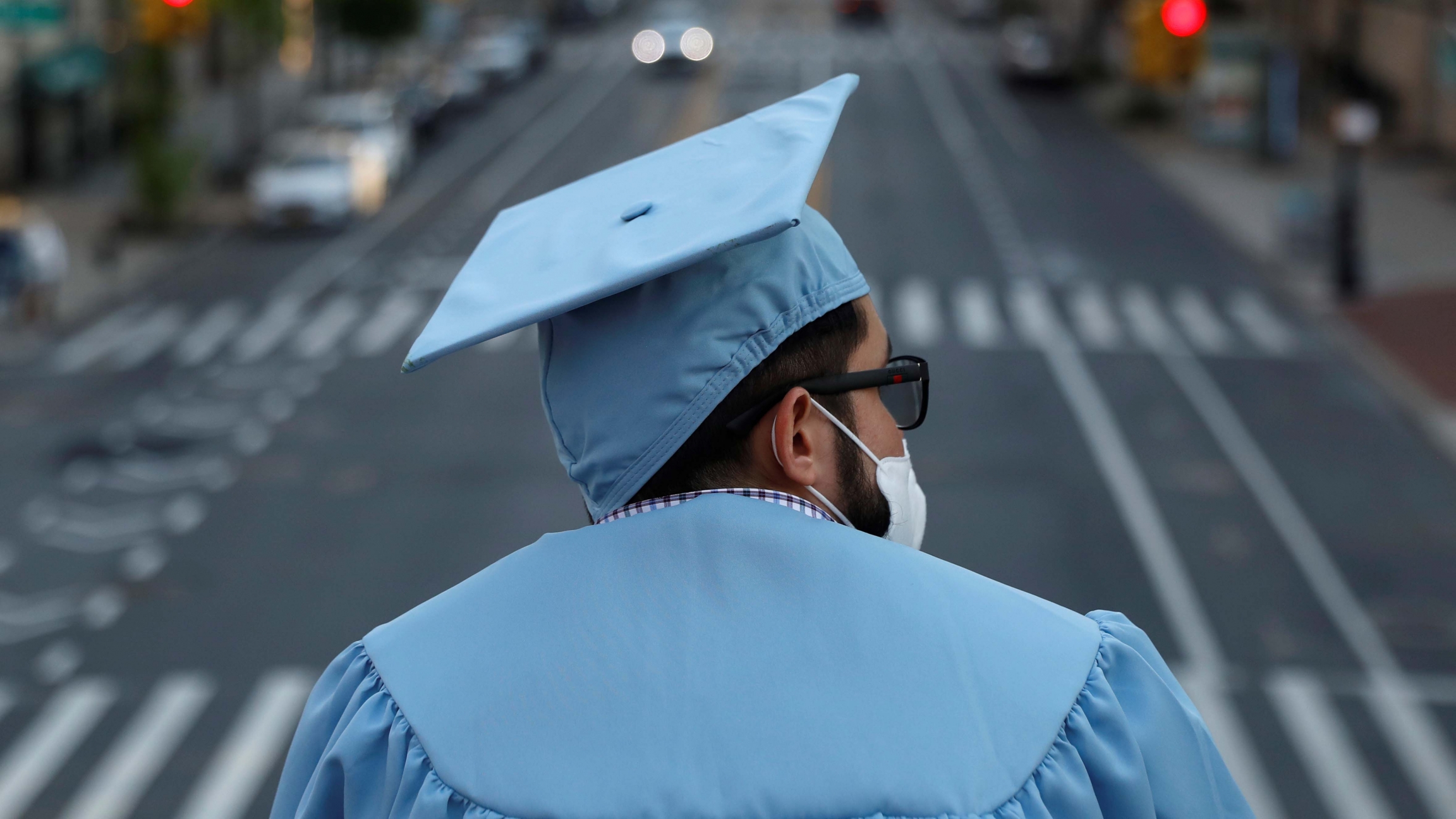 A graduating Masters student from the Columbia University stands on campus the day before his graduation ceremony, which is to be held online due to the outbreak of the coronavirus disease in New York City, on May 19, 2020. A graduating Masters student from the Columbia University stands on campus the day before his graduation ceremony, which is to be held online due to the outbreak of the coronavirus disease in New York City, on May 19, 2020.