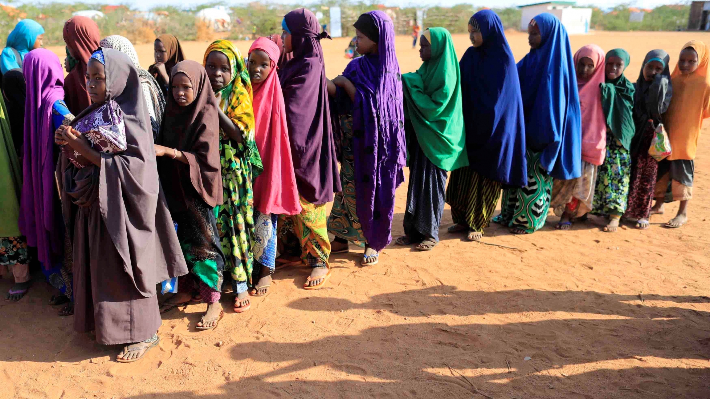 Internally displaced girls in Somalia queue before at a school beside an IDP camp in Dollow, Somalia, April 4, 2017. Internally displaced girls in Somalia queue before at a school beside an IDP camp in Dollow, Somalia, April 4, 2017.