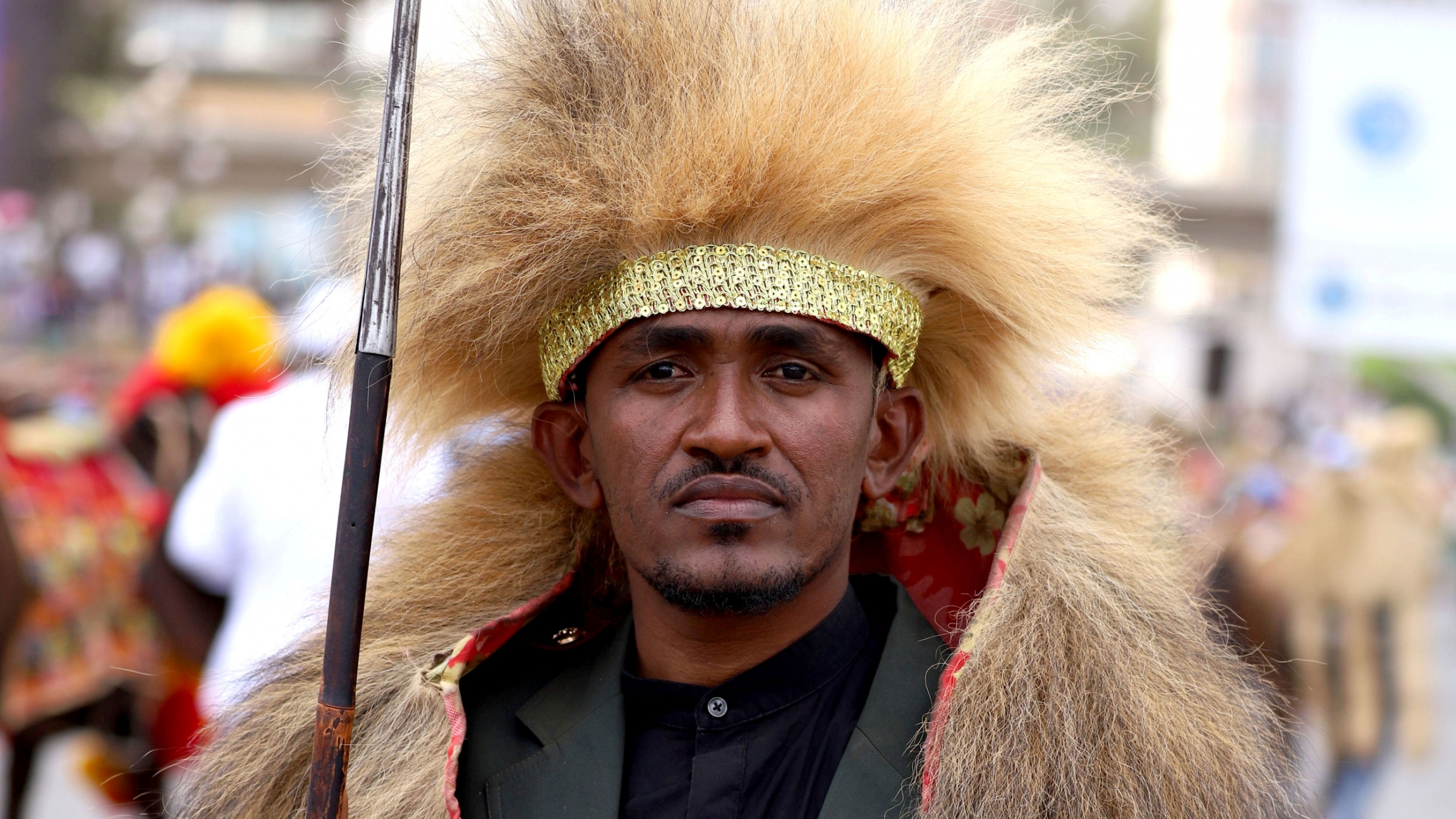 Haacaaluu Hundeessaa A close up of a man in traditional Oromo clothing