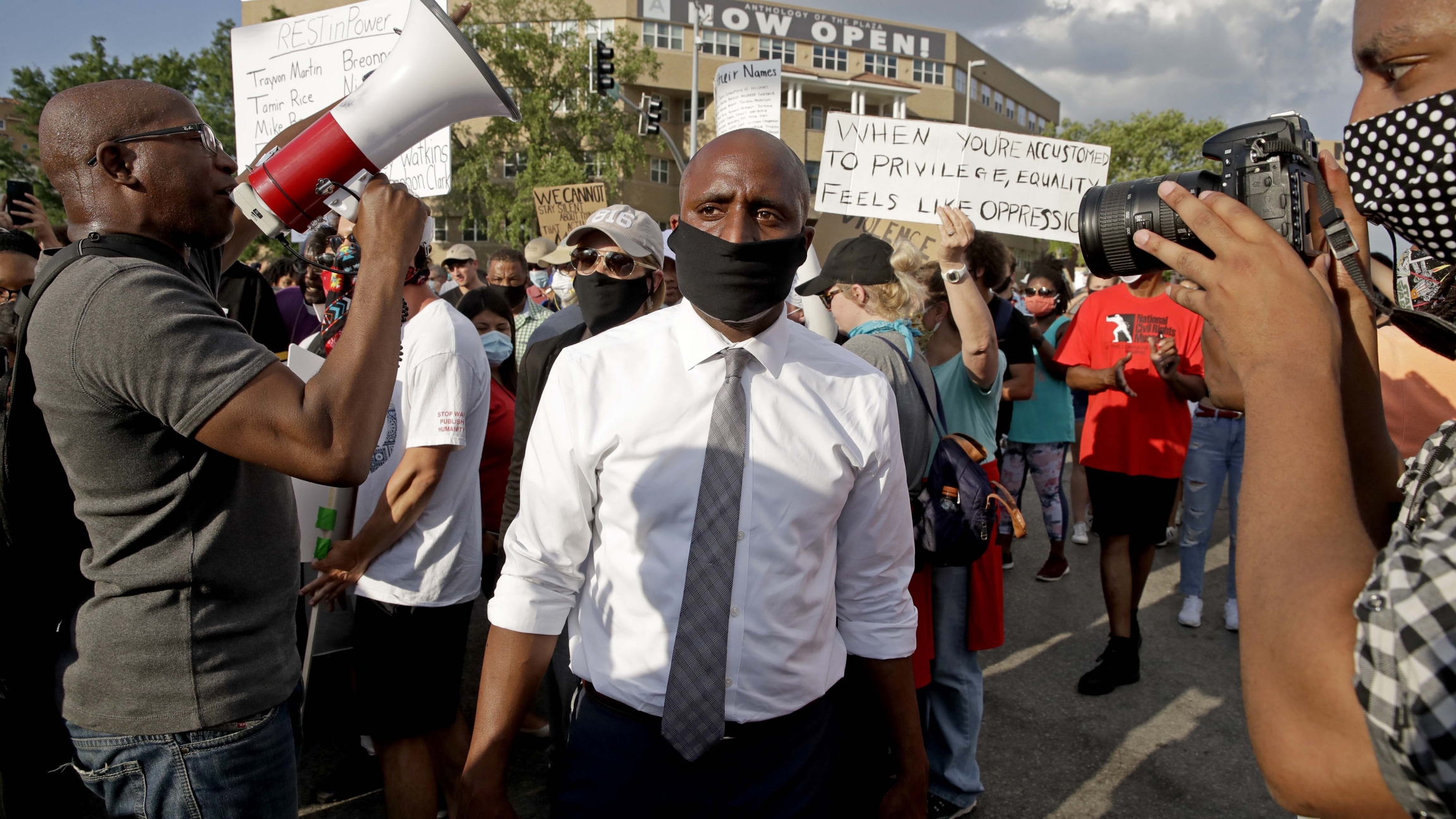 Kansas City mayor Quinton Lucas, center, walks among protesters Wednesday, June 3, 2020, in Kansas City, Mo., during a unity march to protest against police brutality following the death of George Floyd. Kansas City mayor Quinton Lucas, center, walks among protesters Wednesday, June 3, 2020, in Kansas City, Mo., during a unity march to protest against police brutality following the death of George Floyd.