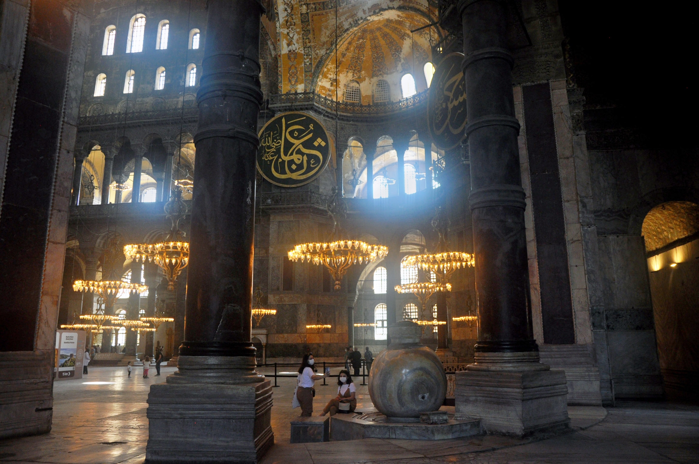 Tourists take in the beauty of the Haghia Sophia interior. Tourists take in the ornate beauty of the Haghia Sophia dome
