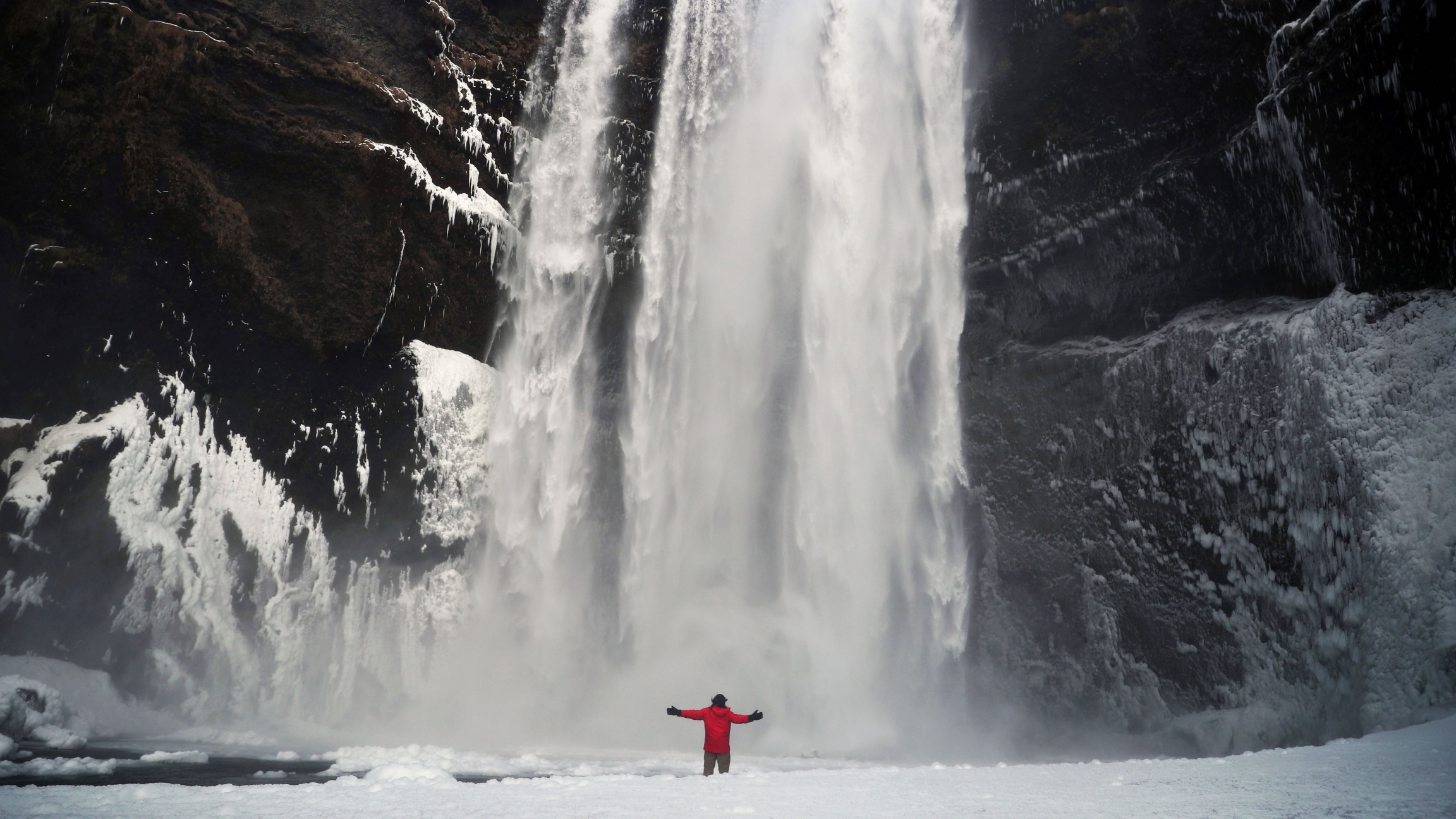 A man stands in front of the Skogafoss waterfall in Skogar, Iceland, March 8, 2020. A man stands in front of the Skogafoss waterfall in Skogar, Iceland, March 8, 2020.