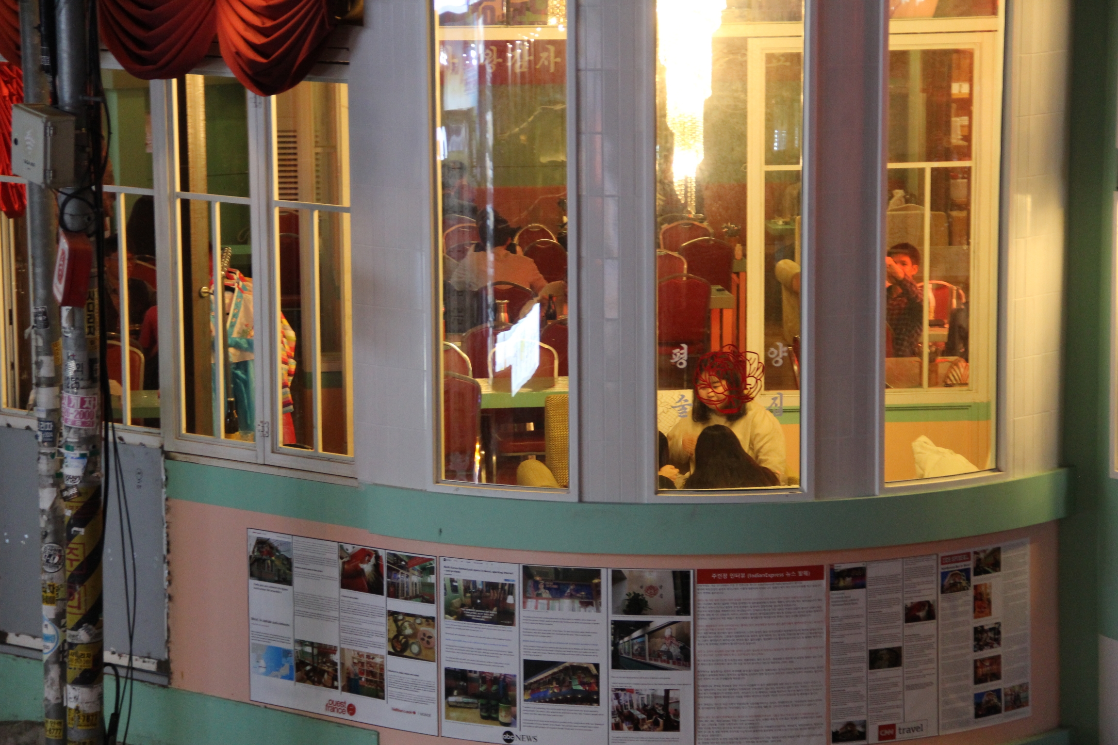 Articles about the pub published by foreign media outlets are taped on the mint walls outside which are reminiscent of North Korea’s pastel-colored buildings. Articles about the pub published by foreign media outlets are taped on the mint walls outside which are reminiscent of North Korea’s pastel-colored buildings.