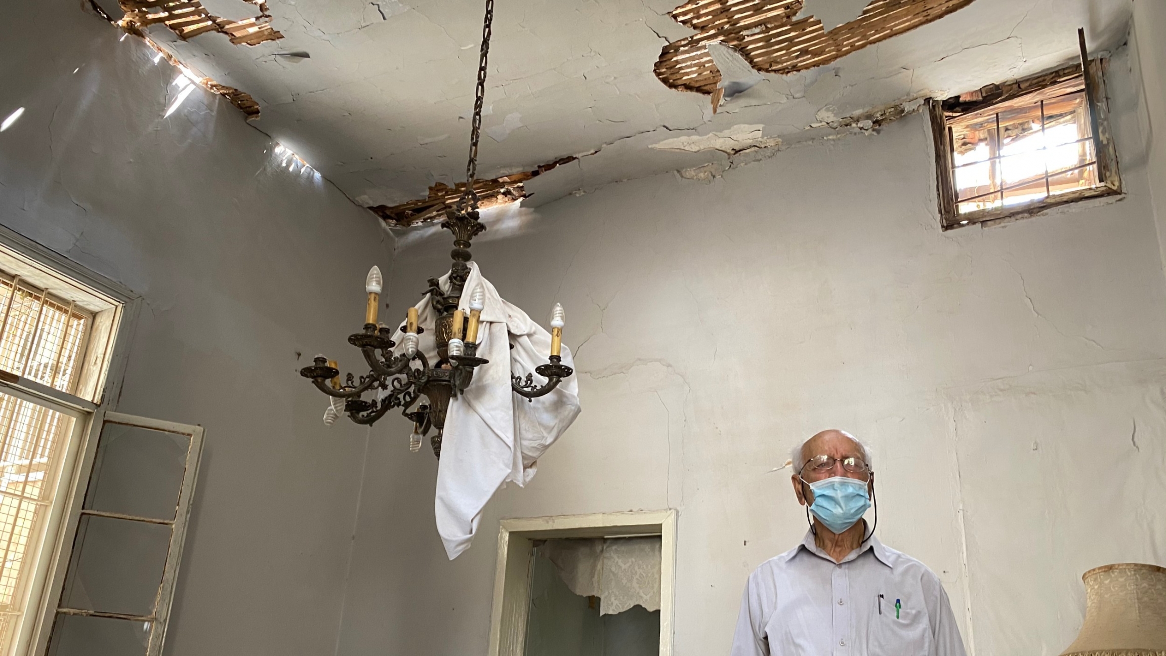 Henri Azar stands inside his home, which was heavily damaged during the August 4 blast at Beirut's port. Henri Azar stands inside his home, which was heavily damaged during the August 4 blast at Beirut's port.