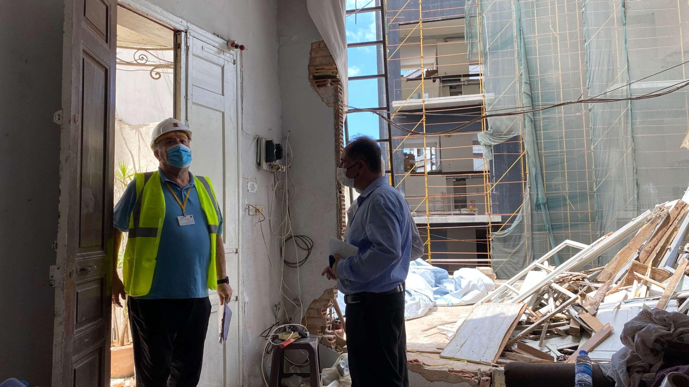 Henri's son Joseph greets an engineer who came to survey the damage at the Azar family home in Beirut's Mar Mikhaël district. Henri's son Joseph greets an engineer who came to survey the damage at the Azar family home in Beirut's Mar Mikhaël district.