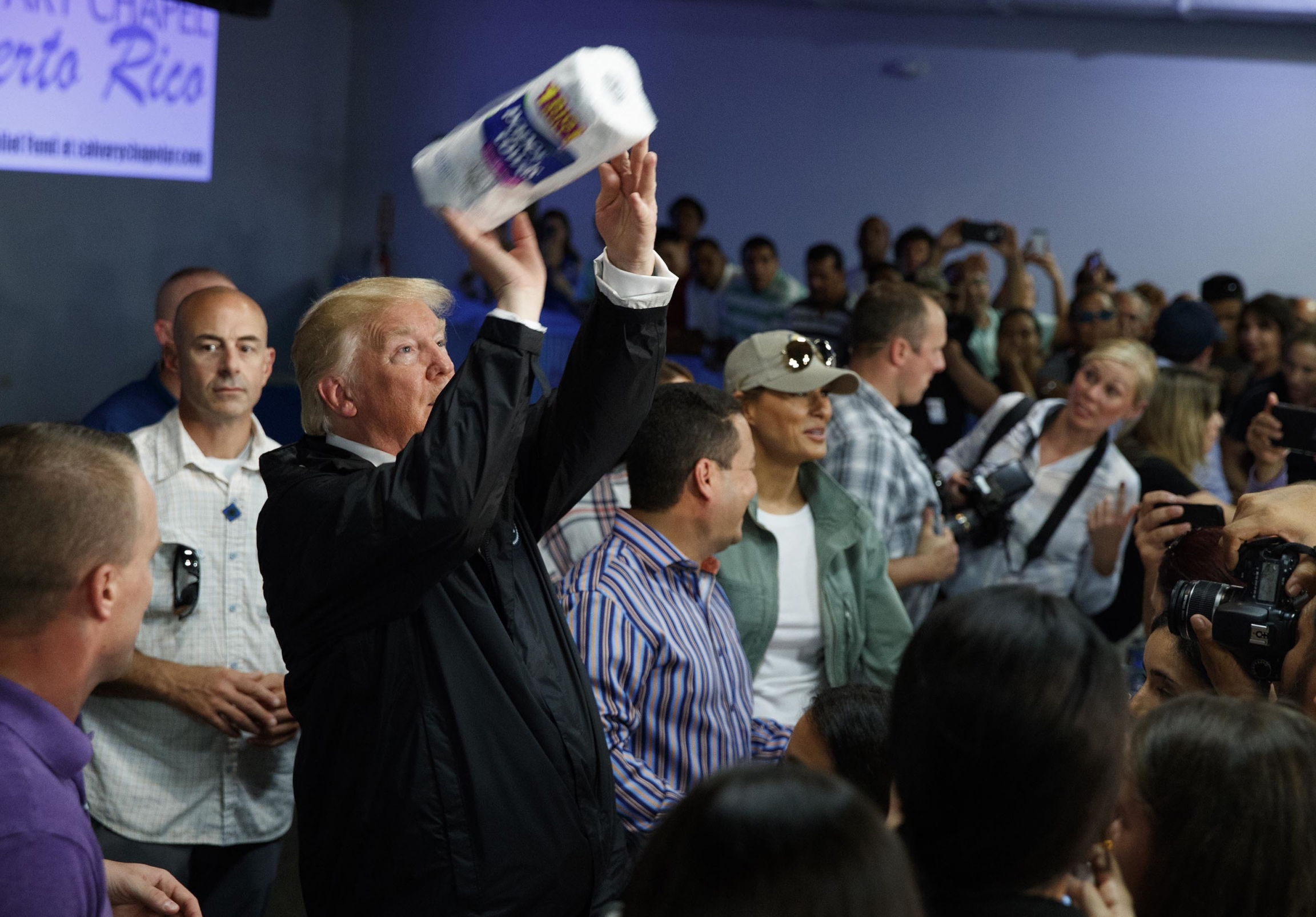 In this Oct. 3, 2017, file photo, President Donald Trump tosses paper towels into a crowd at Calvary Chapel in Guaynabo, Puerto Rico, after Hurricane Maria devastated the region. In this Oct. 3, 2017, file photo, President Donald Trump tosses paper towels into a crowd at Calvary Chapel in Guaynabo, Puerto Rico, after Hurricane Maria devastated the region.