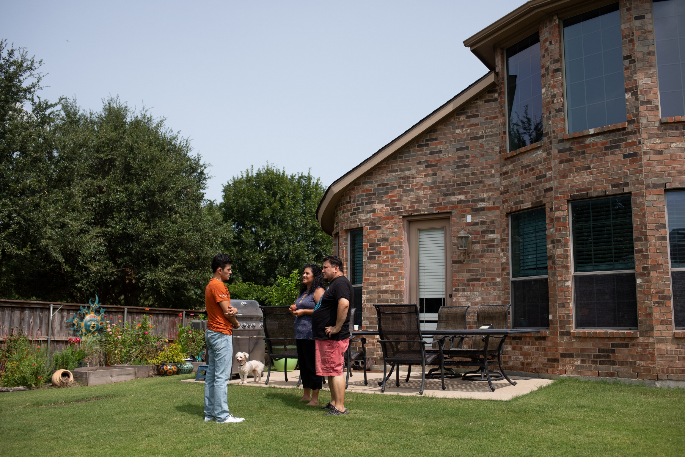 Izcan Ordaz, left, and his parents in the backyard of their home in Fort Worth, Texas. Izcan Ordaz, left, and his parents in the backyard of their home in Fort Worth, Texas.