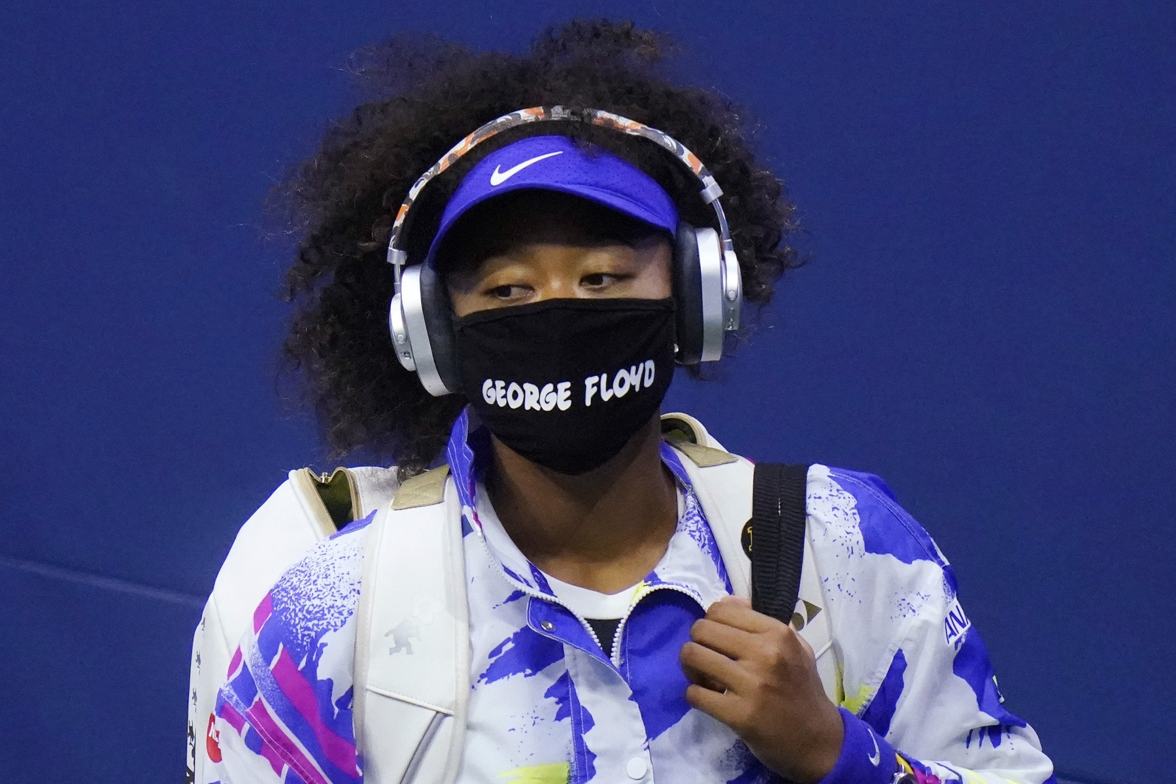 Naomi Osaka wears a protective mask due to the COVID-19 virus outbreak, featuring the name "George Floyd," during the quarterfinal round of the US Open tennis championships, Tuesday, Sept. 8, 2020, in New York. Naomi Osaka wears a mask that reads "George Floyd"