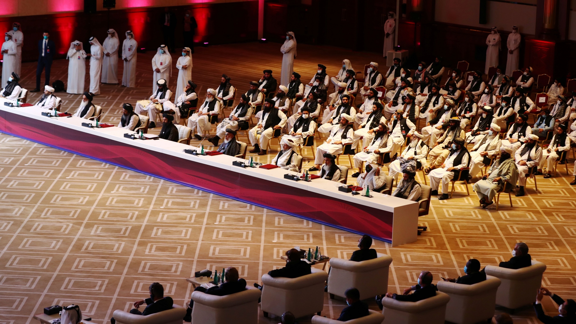 Delegates attend talks between the Afghan government and Taliban insurgents in Doha, Qatar, Sept. 12, 2020. Delegates attend talks between the Afghan government and Taliban insurgents in Doha, Qatar, Sept. 12, 2020.