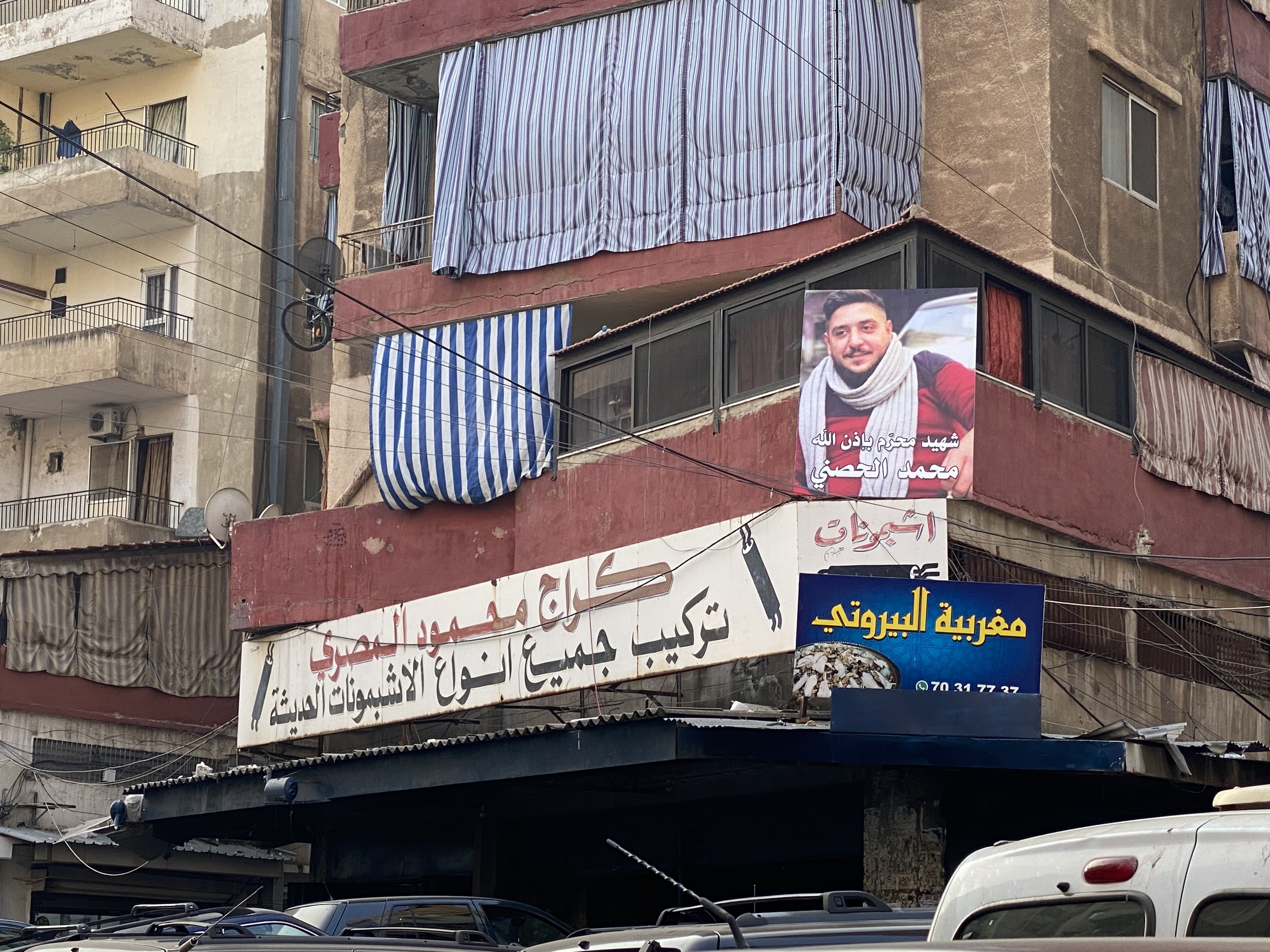 A picture of Mohammed Hosni hangs in the streets of his Tripoli neighborhood. A picture of Mohammed Hosni hangs in the streets of his Tripoli neighborhood.