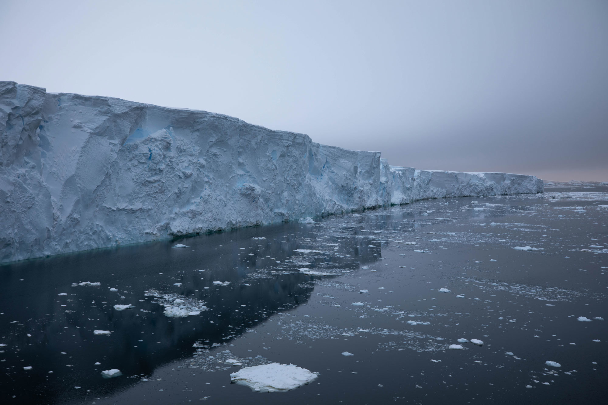 Layers of snow are like the rings in trees and can help scientists date glaciers. Layers of snow are shown along the edge of Thwaites Glacier
