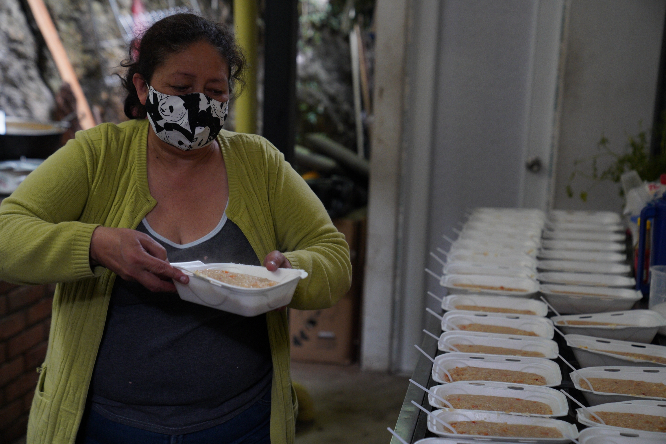 Martha Duque prepares meals for migrants at her home in Pamplona Colombia, on Oct. 1. Duque used to run a shelter for women and children but was forced to shut it down due to the pandemic. Martha Duque prepares meals for migrants at her home in Pamplona Colombia, on Oct. 1. Duque used to run a shelter for women and children but was forced to shut it down due to the pandemic.