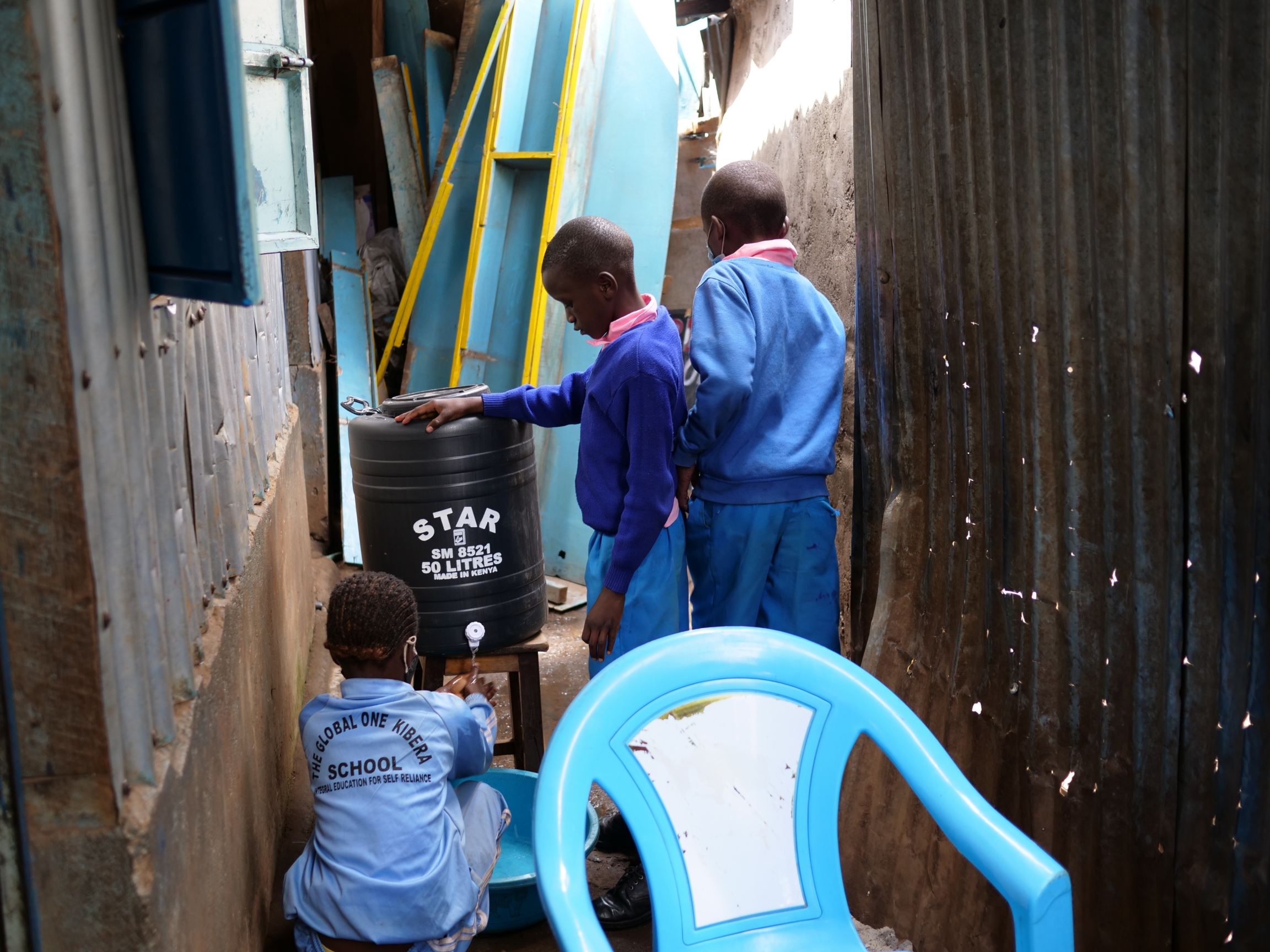 Primary school students wash their hands before a snack break at the Global One School in Nairobi, Kenya. Primary school students wash their hands before a snack break at the Global One School in Nairobi, Kenya.