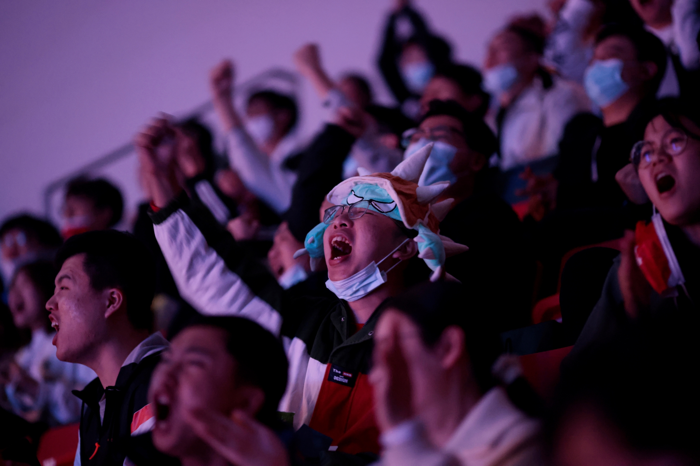 Fans react at the League of Legends (LOL) World Championship Finals, in Shanghai. 