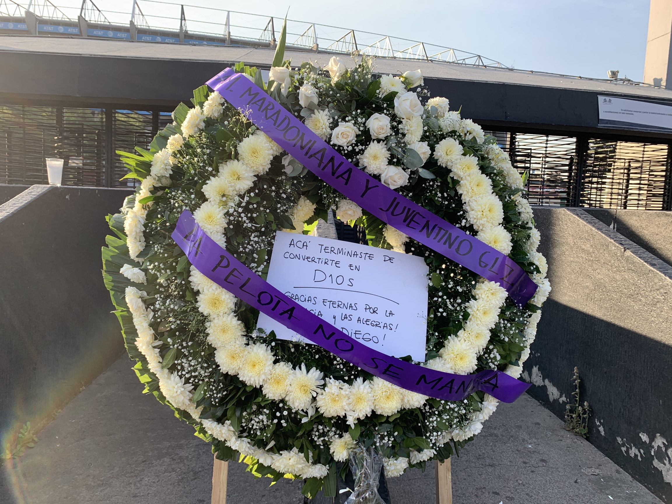 A wreath for Diego Maradona reading, "This is where you became God" sits outside Estadio Azteca, the stadium where Maradona led Argentina to defeat England in the 1986 World Cup, in Mexico City, Mexico, Nov. 26, 2020. A wreath for Diego Maradona reading, "This is where you became God" sits outside Estadio Azteca, the stadium where Maradona led Argentina to defeat England in the 1986 World Cup, in Mexico City, Mexico, Nov. 26, 2020.