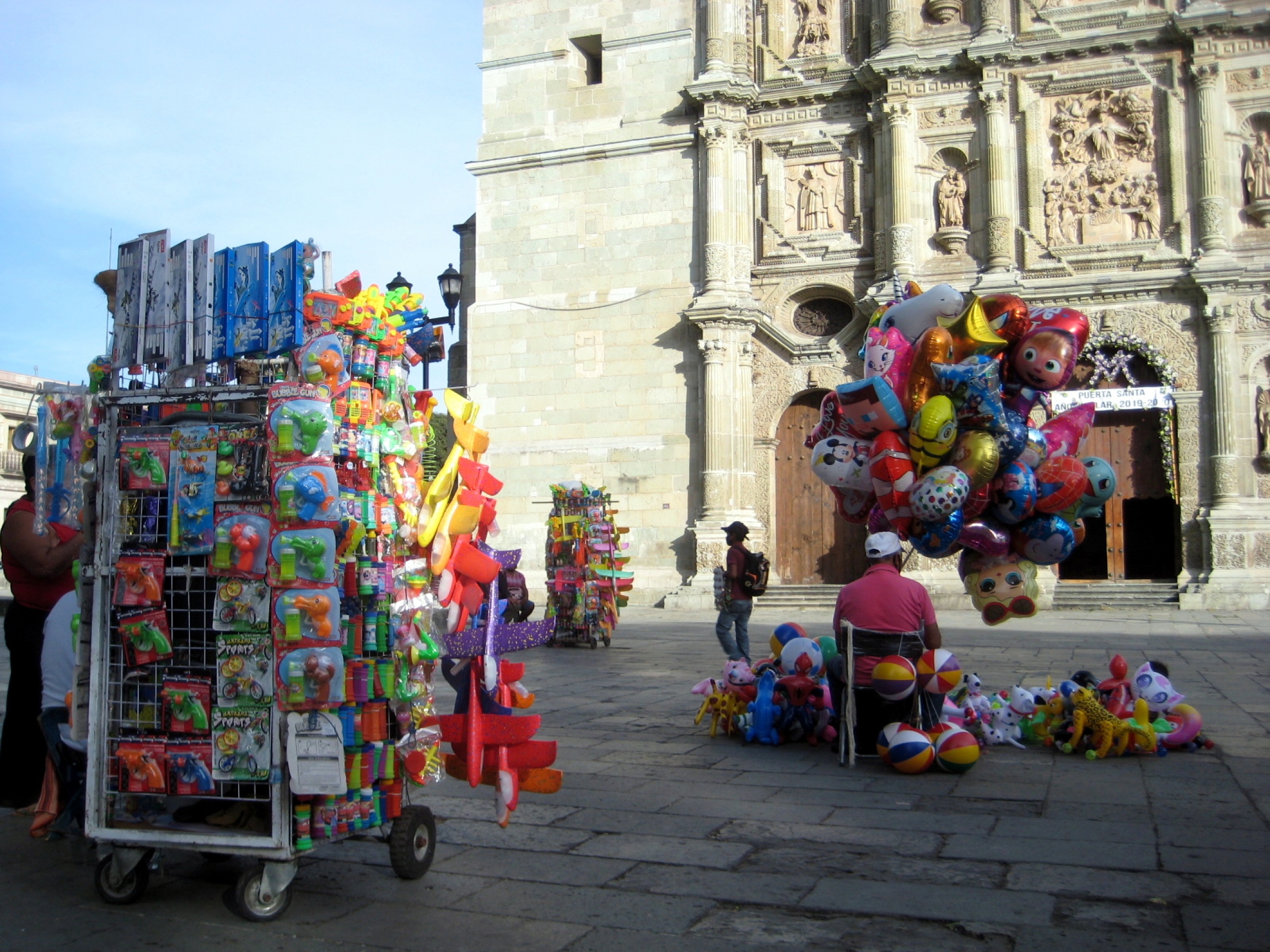 Vendors in front of Oaxaca's landmark cathedral have been outnumbering potential clients these days. Vendors in front of Oaxaca's landmark cathedral have been outnumbering potential clients these days.