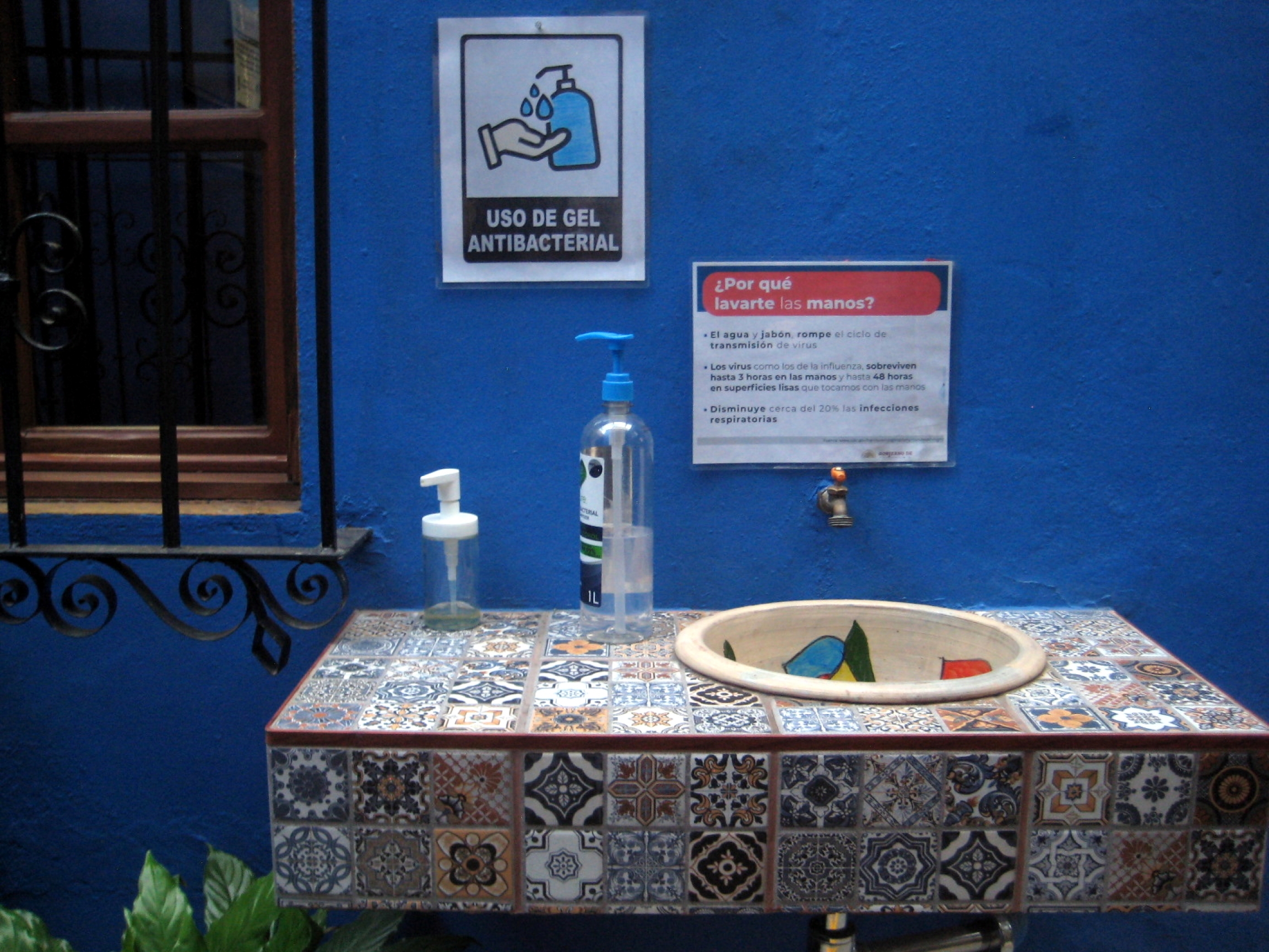 Hygiene station at the entrance of Las Golondrinas Hotel include a sink for hand-washing and a bottle with antibacterial gel Hygiene station at the entrance of Las Golondrinas Hotel include a sink for hand-washing and a bottle with antibacterial gel.